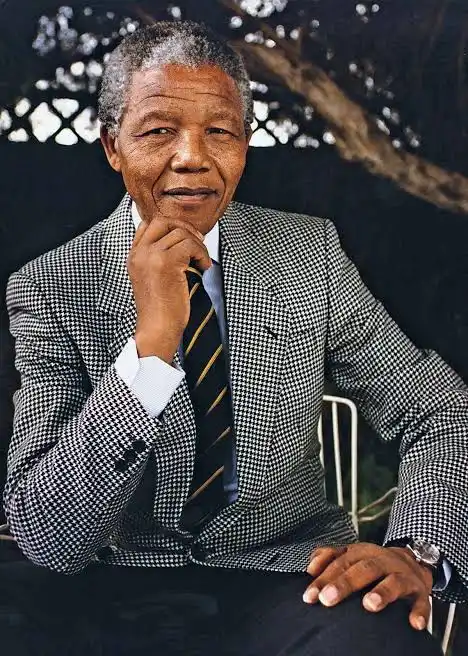 Nelson Mandela in a checkered black and white suit