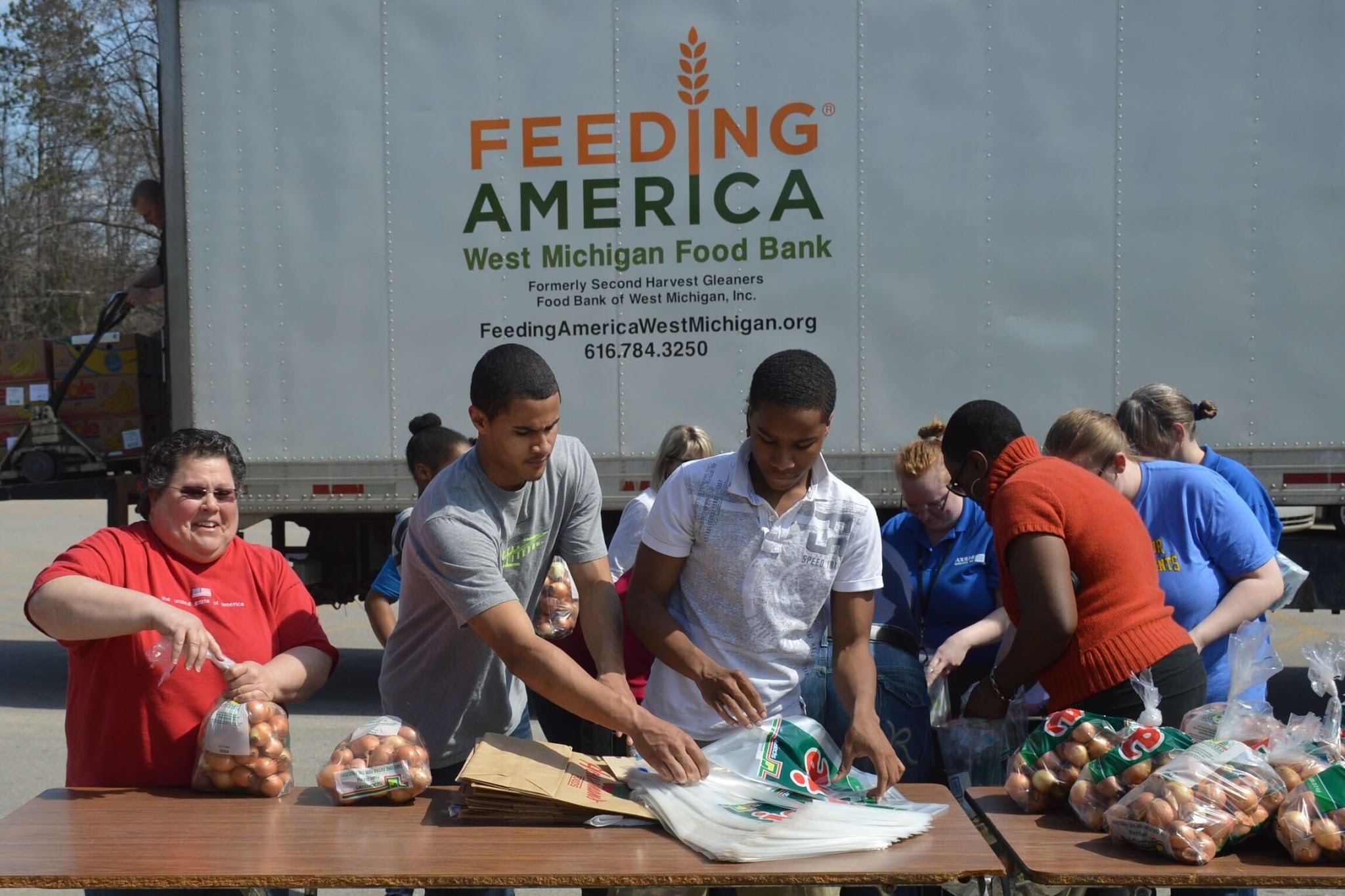 Volunteers participating in a food supply drive