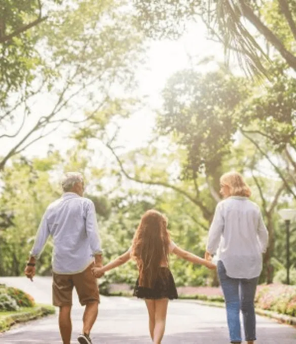 Happy family walk on nature on sunset hold hand