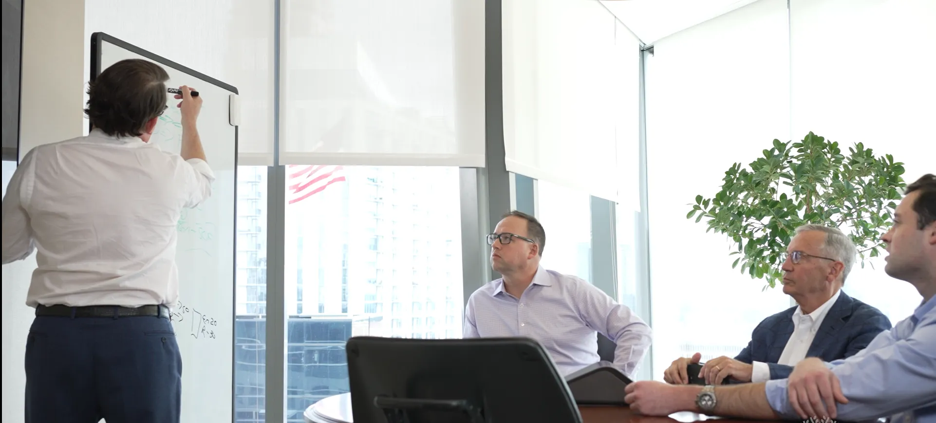 Balentine Investment Team discussing their next strategy at a meeting