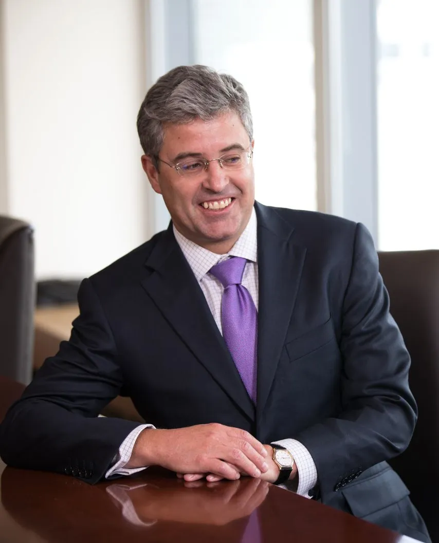 Happy employee discussing client portfolio during a business meeting. 