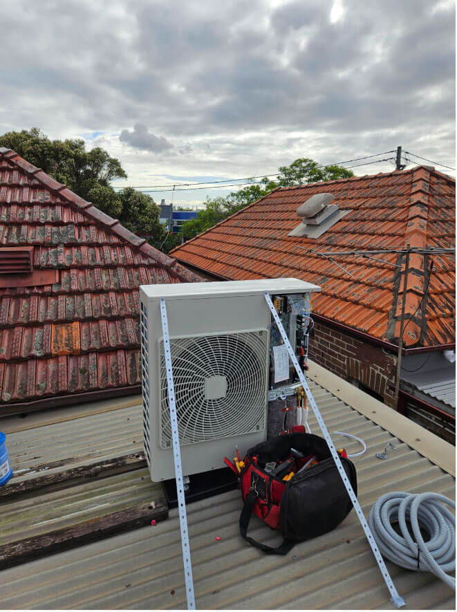 Ozcon Air Solutions technicians installing a new energy-efficient ducted air conditioning system