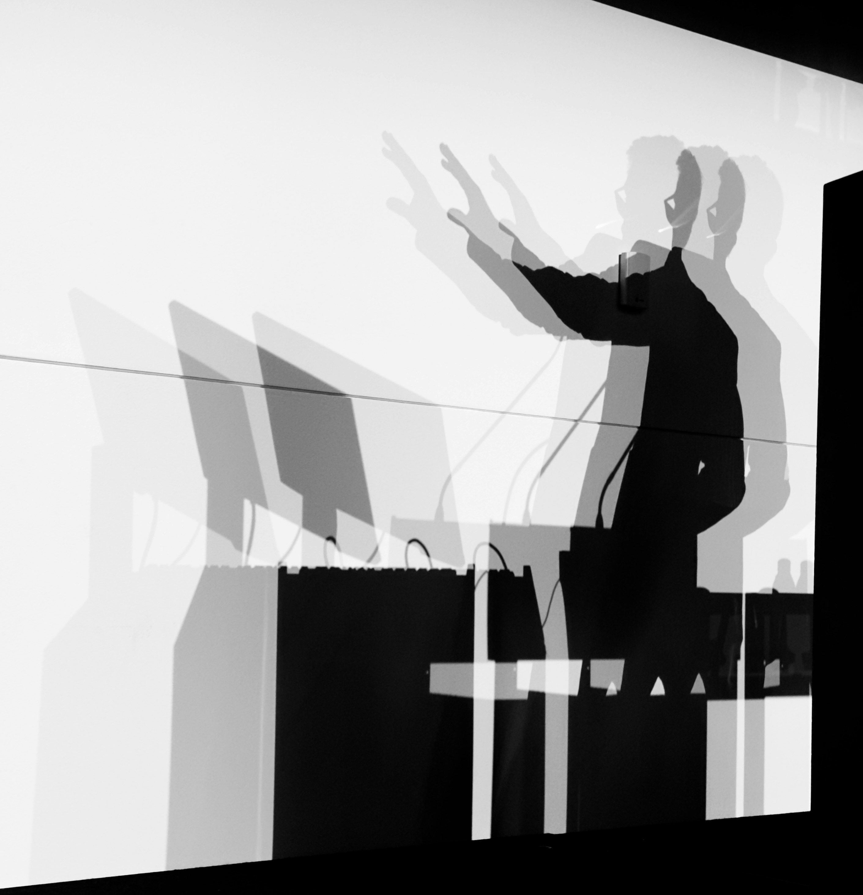 Person speaking at a desk.