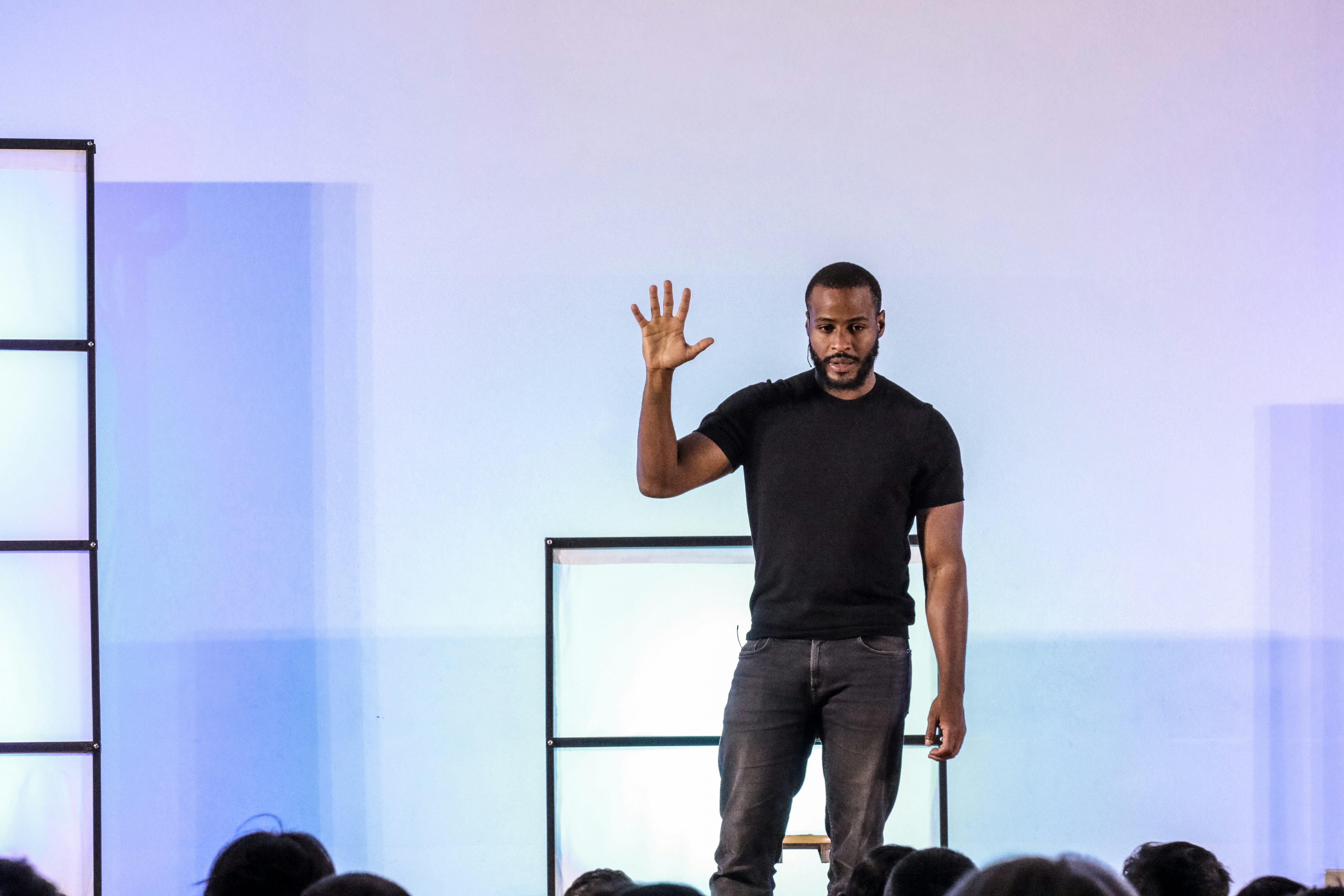 Person giving a presentation onstage.