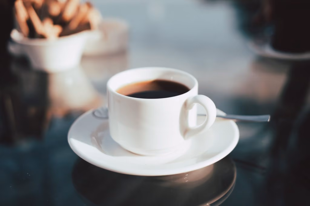 Cup of coffee on glass table