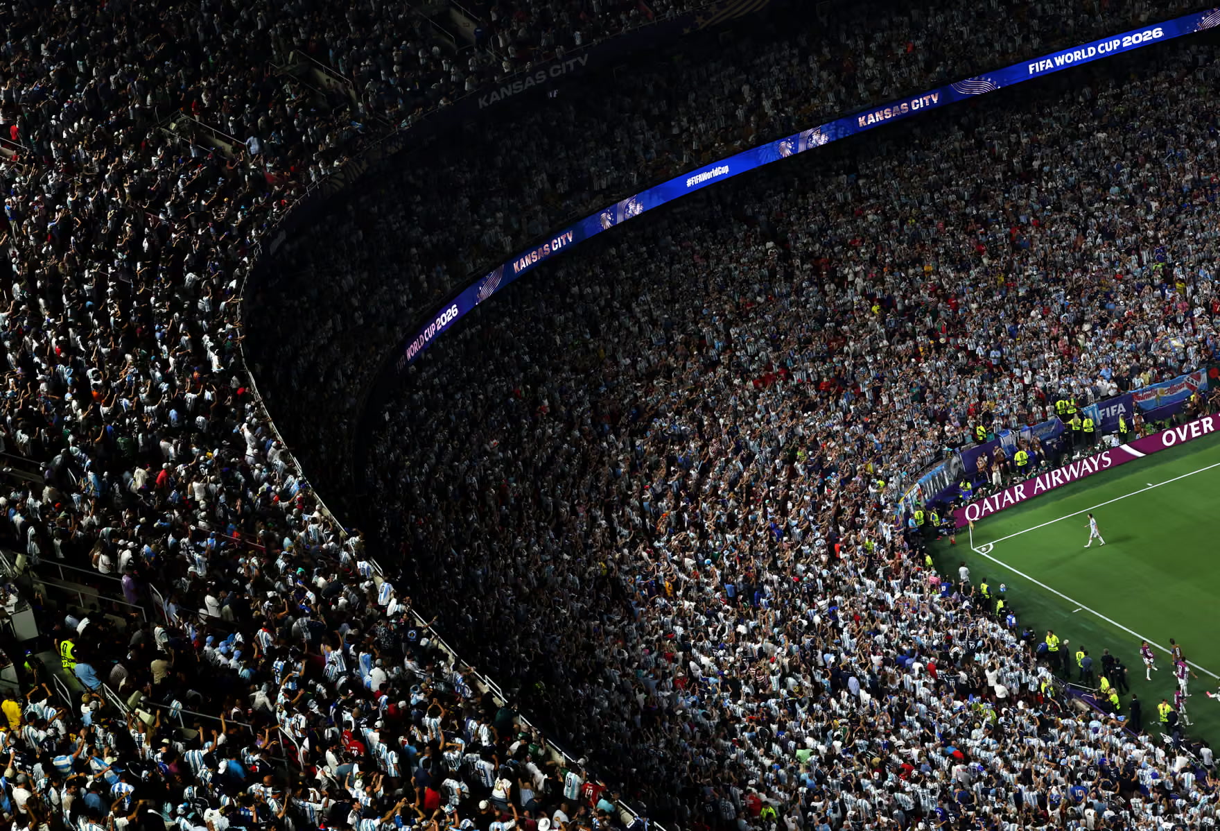Kansas City stadium crowd beneath tournament LED branding