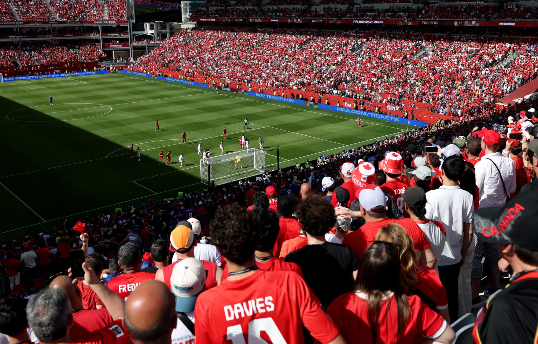 Toronto stadium with ticketing graphics along the pitch-side LED