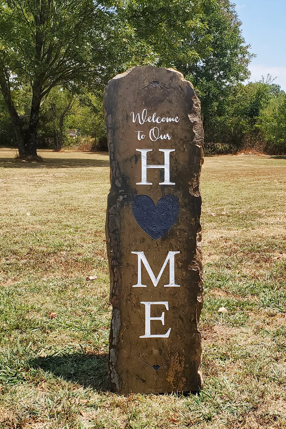 Engraved Stone with welcome to our home sign