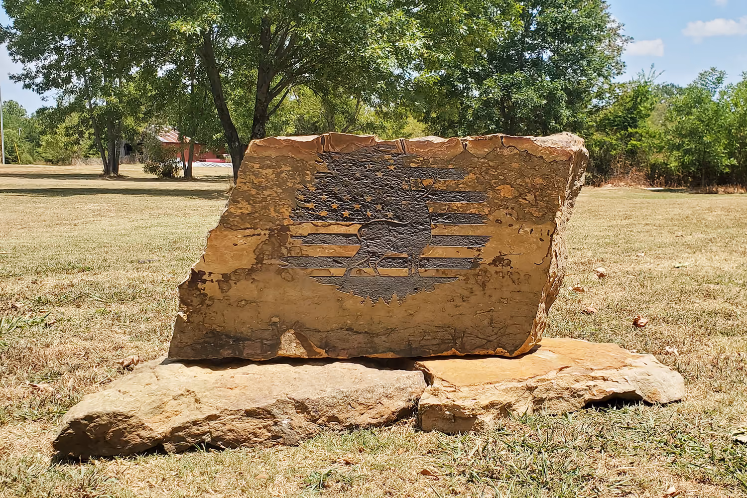 Engraved Stone with flag and animal sign