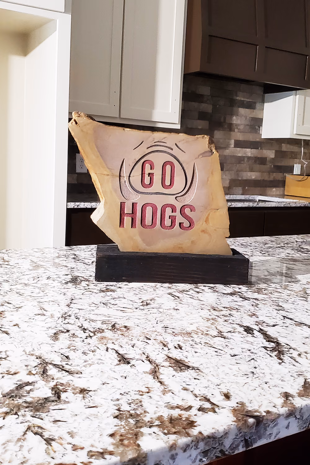 Engraved Stone with go hog sign