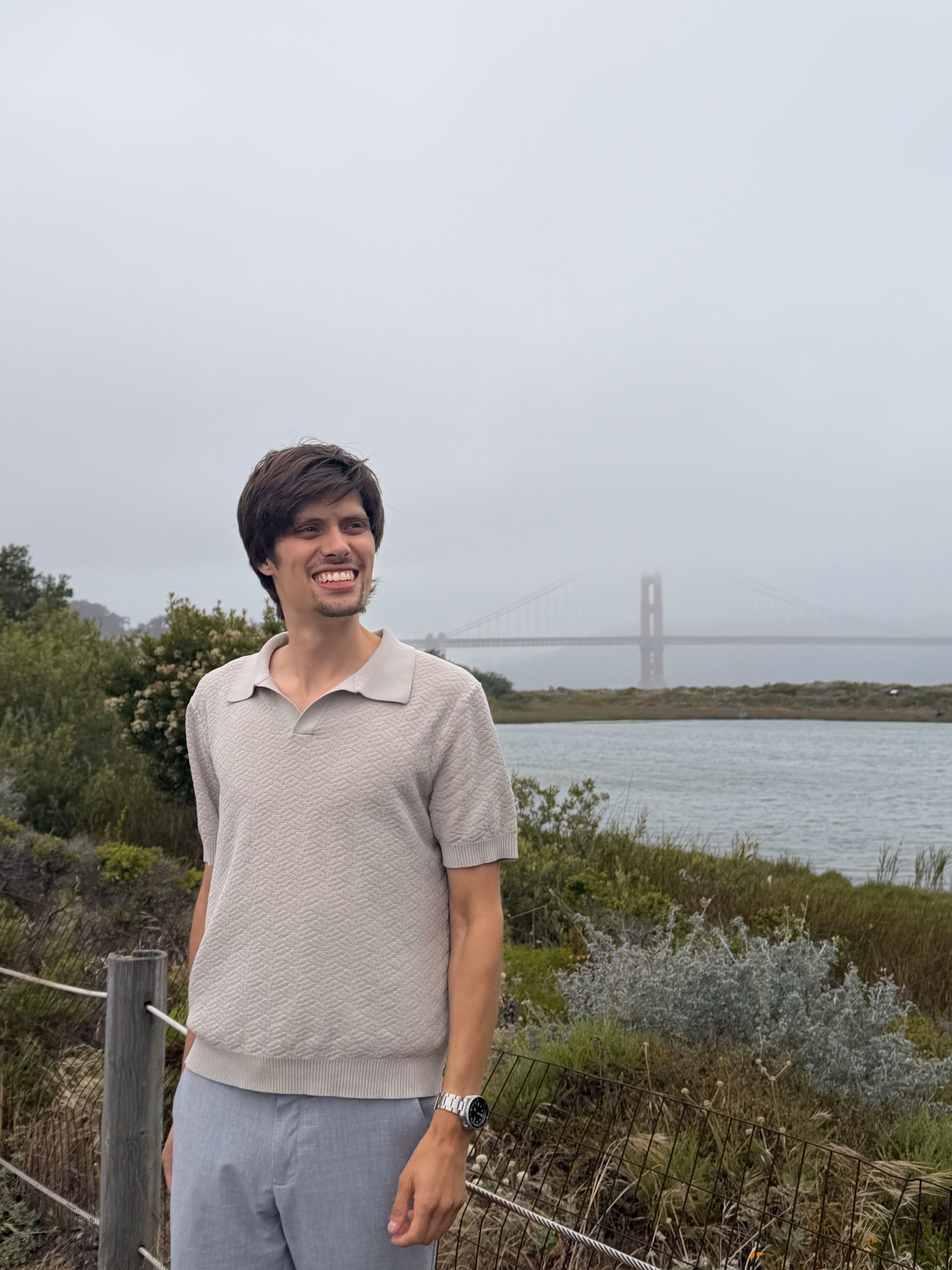 Gabriel Burch, Founder and COO of Precision Social, stands in front of the Golden Gate Bridge in San Francisco, CA.