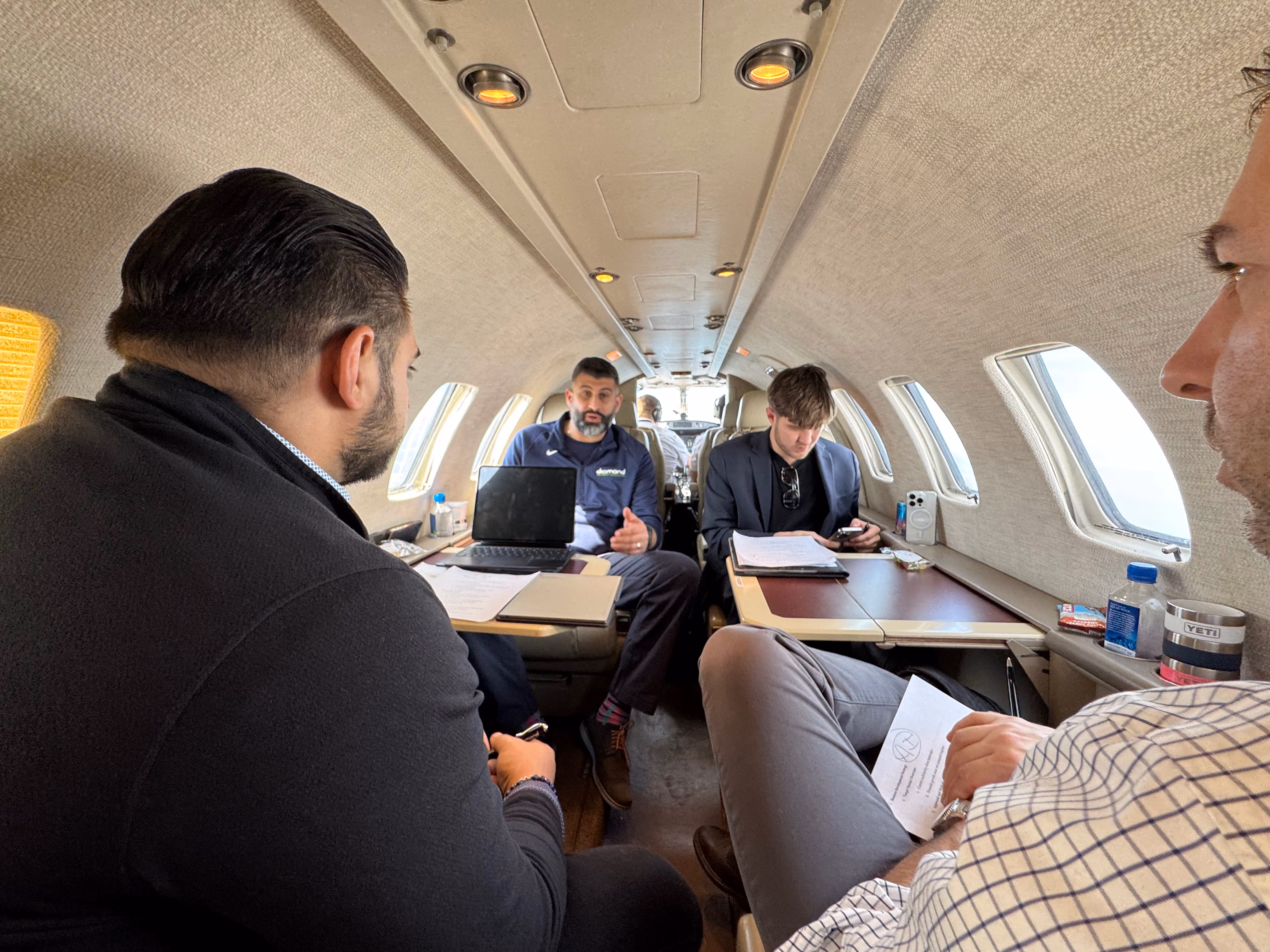 Precision Social in a strategy session with a client on a plane.