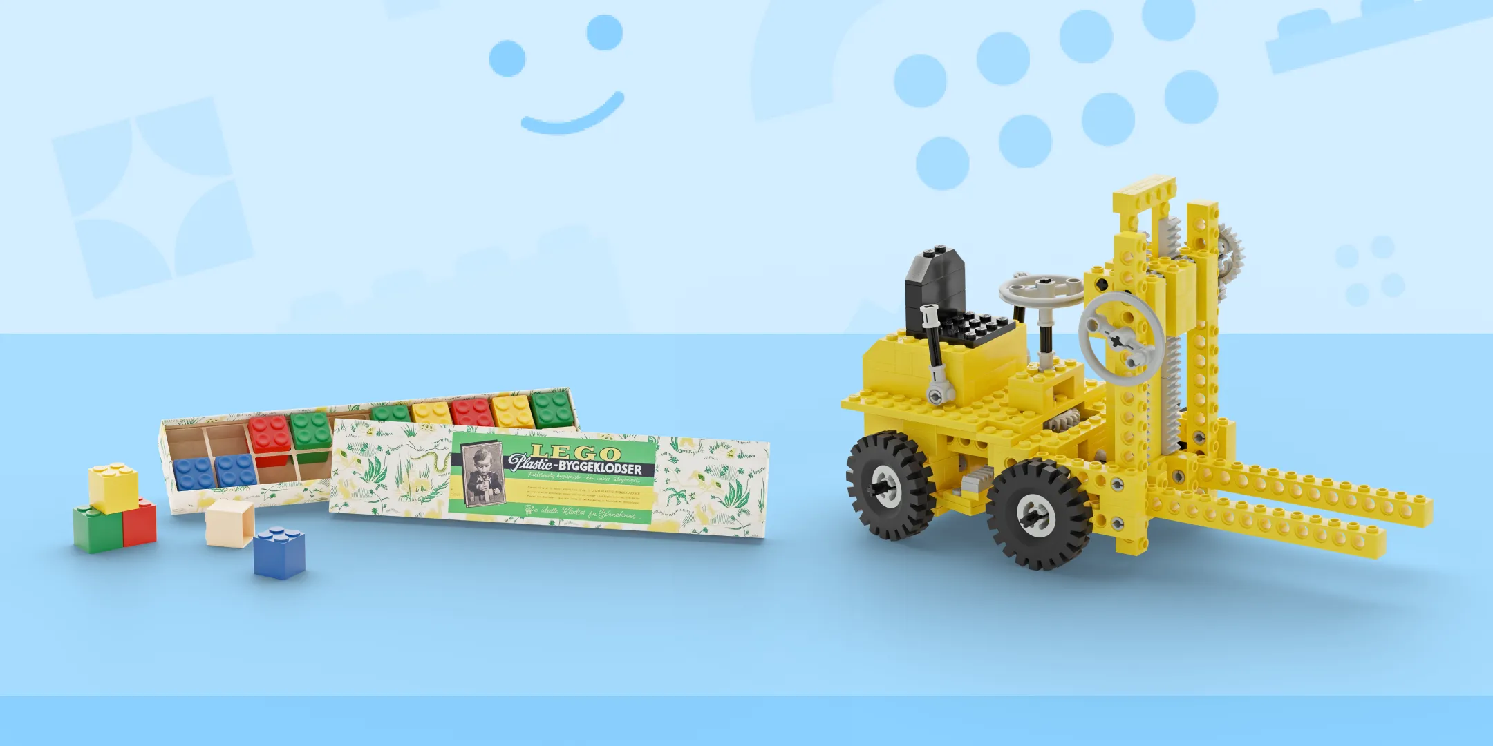 A classic LEGO set with a yellow mechanical crane and an assortment of colorful blocks next to a vintage LEGO packaging box, against a light blue background with a LEGO brick pattern.