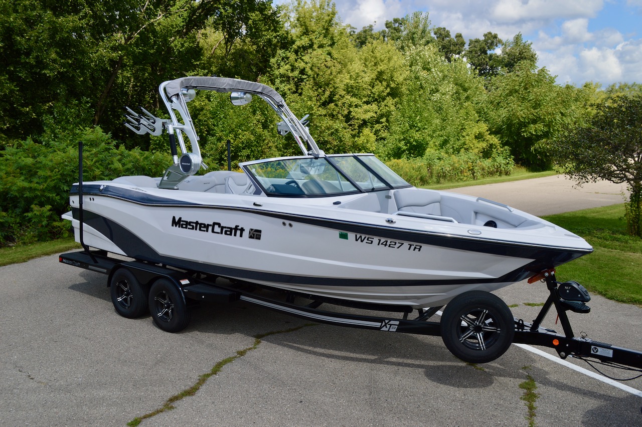 2020 Mastercraft XT23 | Redline Watersports | For Sale in Madison WI | Starboard side view on trailer