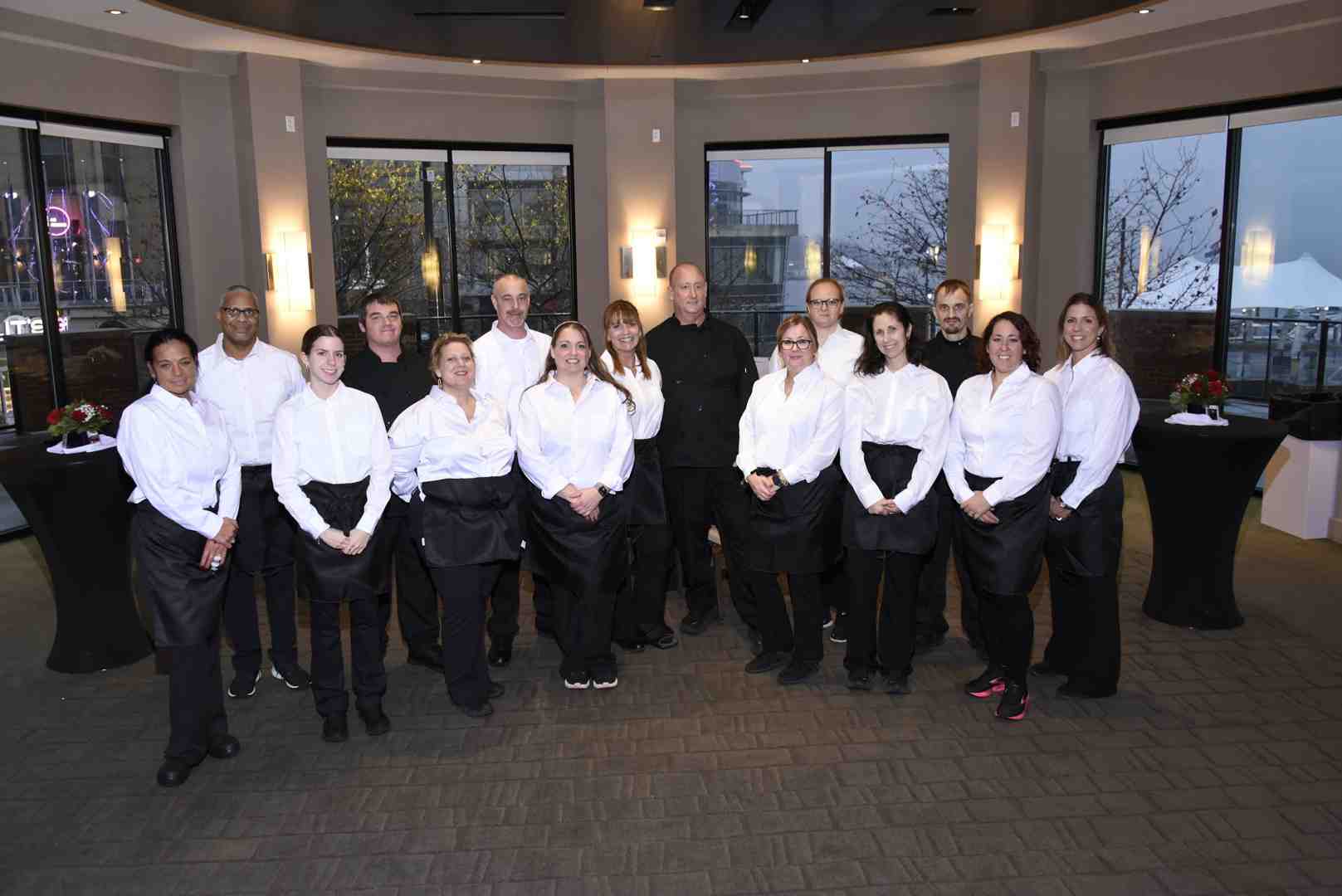 Professional catering team serving guests at a festive holiday event