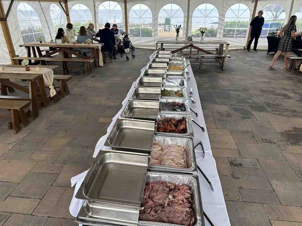 A professional on-site catering setup with chafing dishes