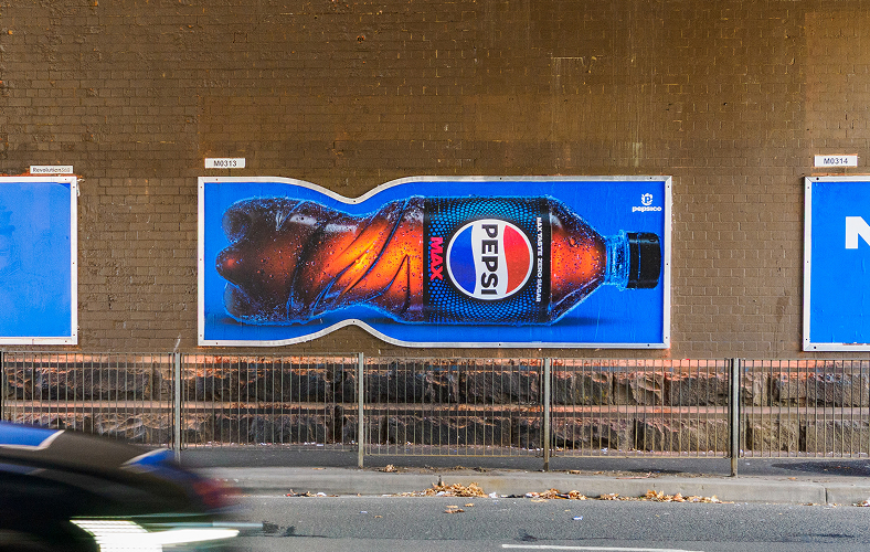 Pepsi billboard bent following the shape of the bottle