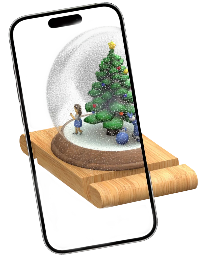 Smartphone displaying a snow globe with a decorated Christmas tree and two figurines inside, placed on a wooden sled.