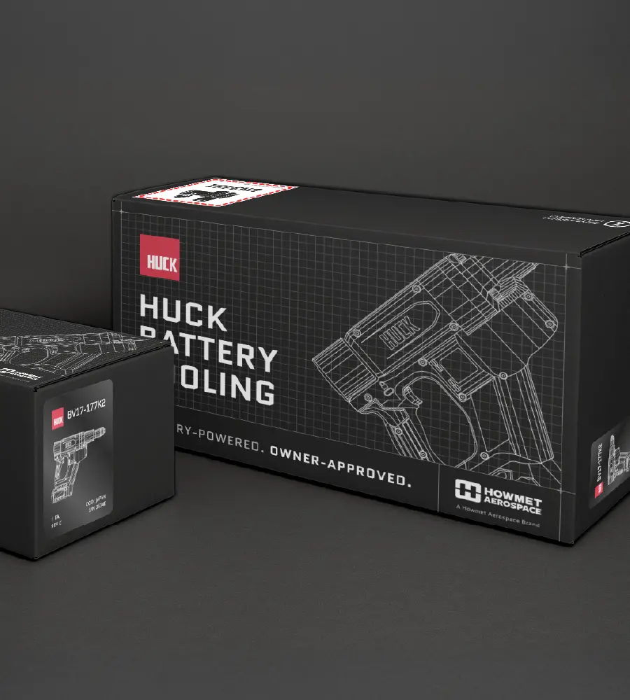 Two black product boxes for HUCK Battery Tooling with technical line drawings of tools on the packaging.