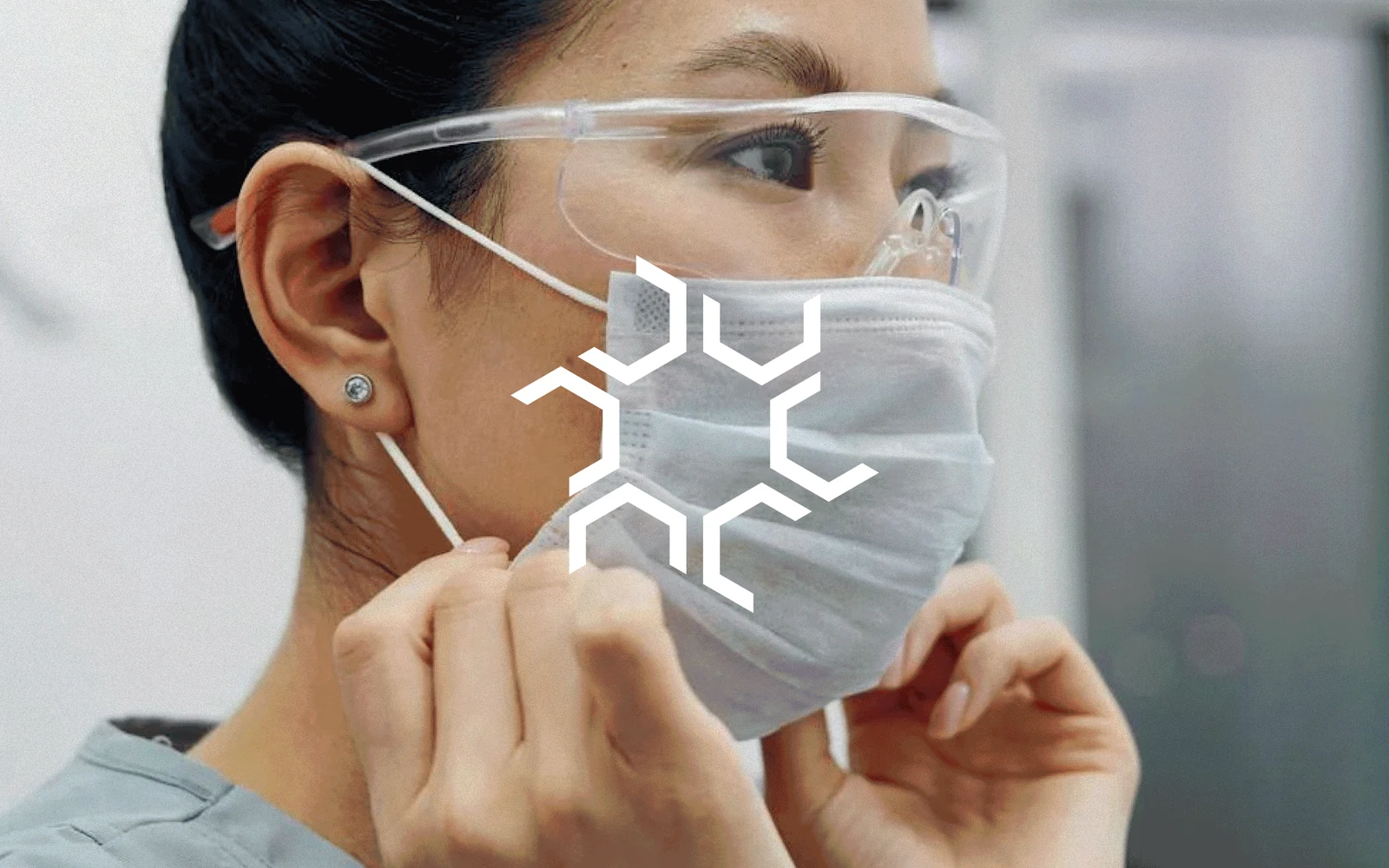 Animated Aonis medical brand study featuring its white geometric mark over laboratory imagery.