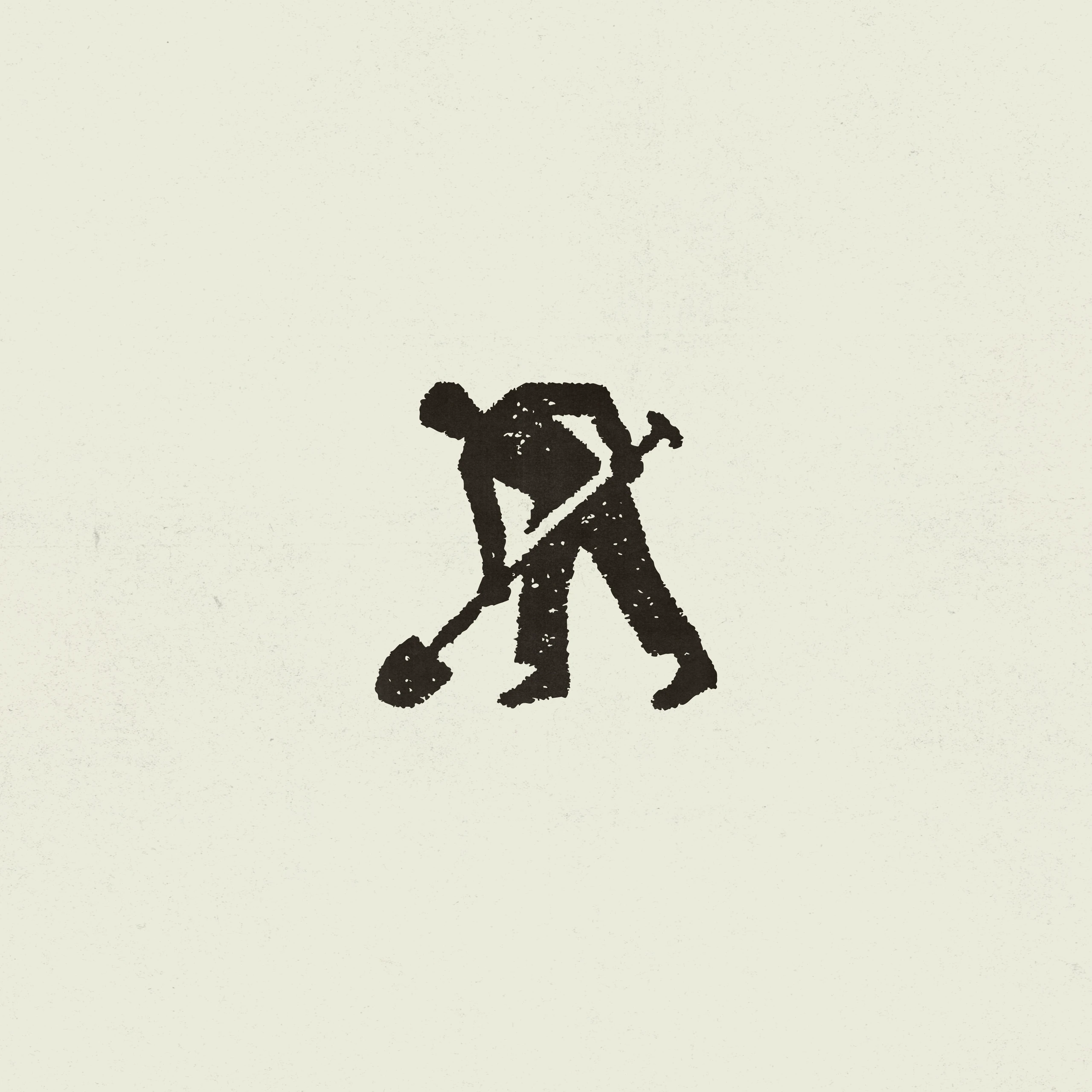 Rough black silhouette of a worker using a shovel, centered on textured cream paper.