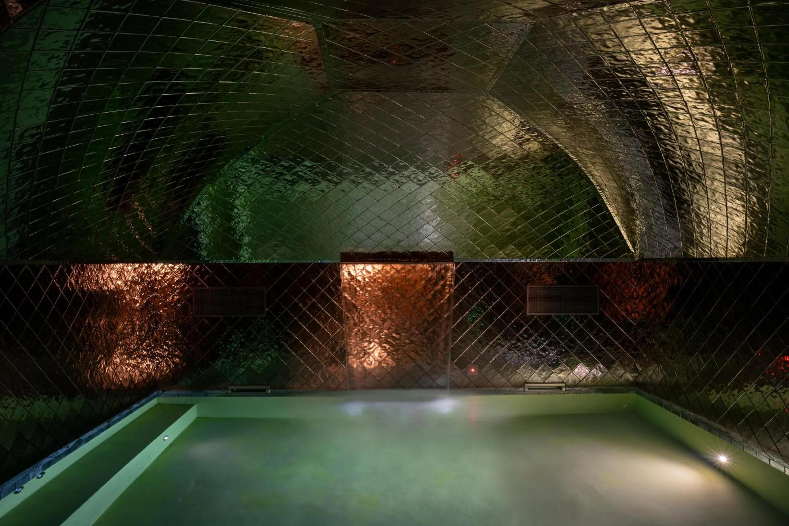 Palazzo Talìa spa with green-tiled vaulted ceiling and experiential plunge pool