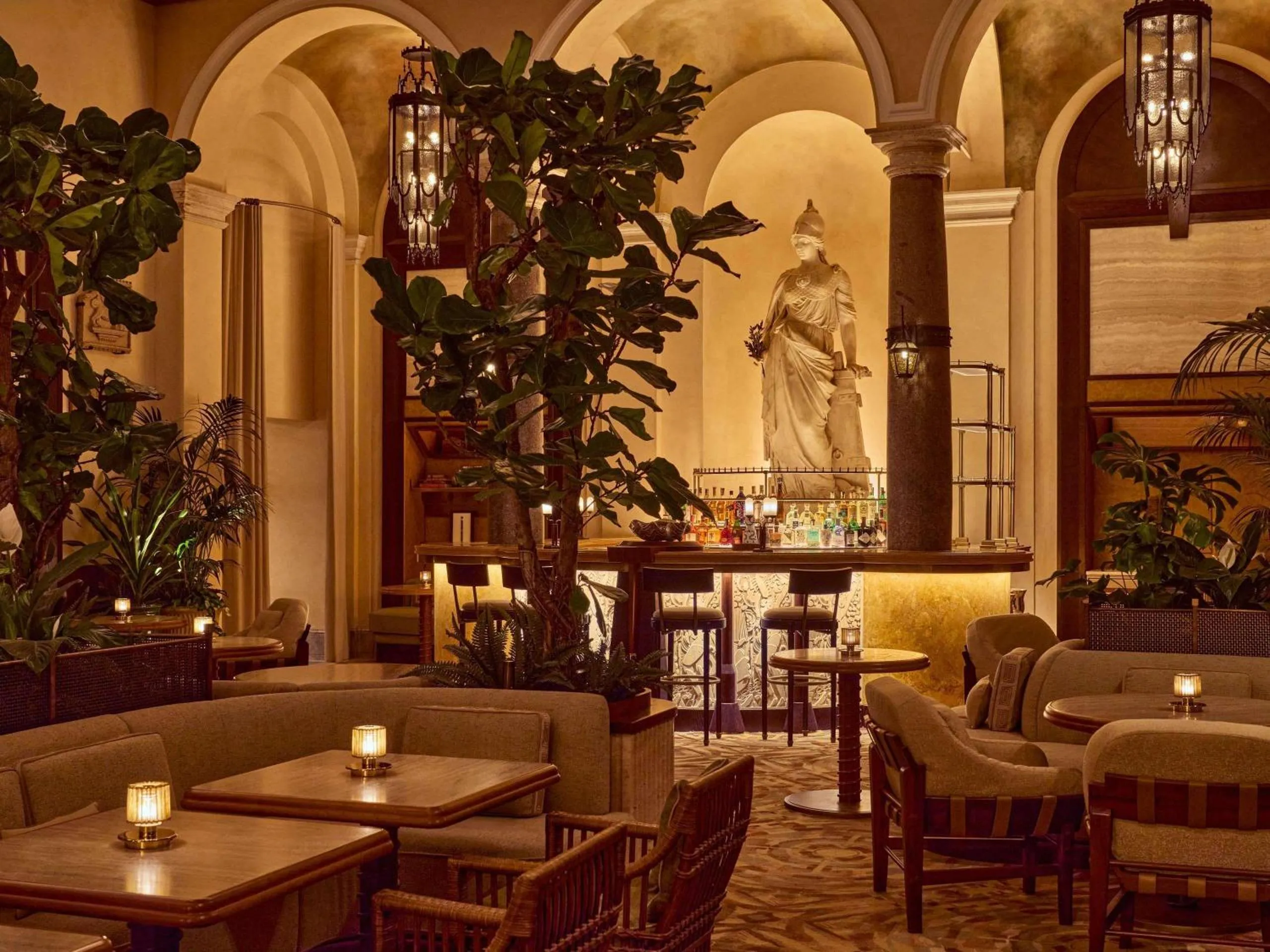 La Minerva Bar at Orient Express La Minerva with the marble Minerva statue and arched ceiling