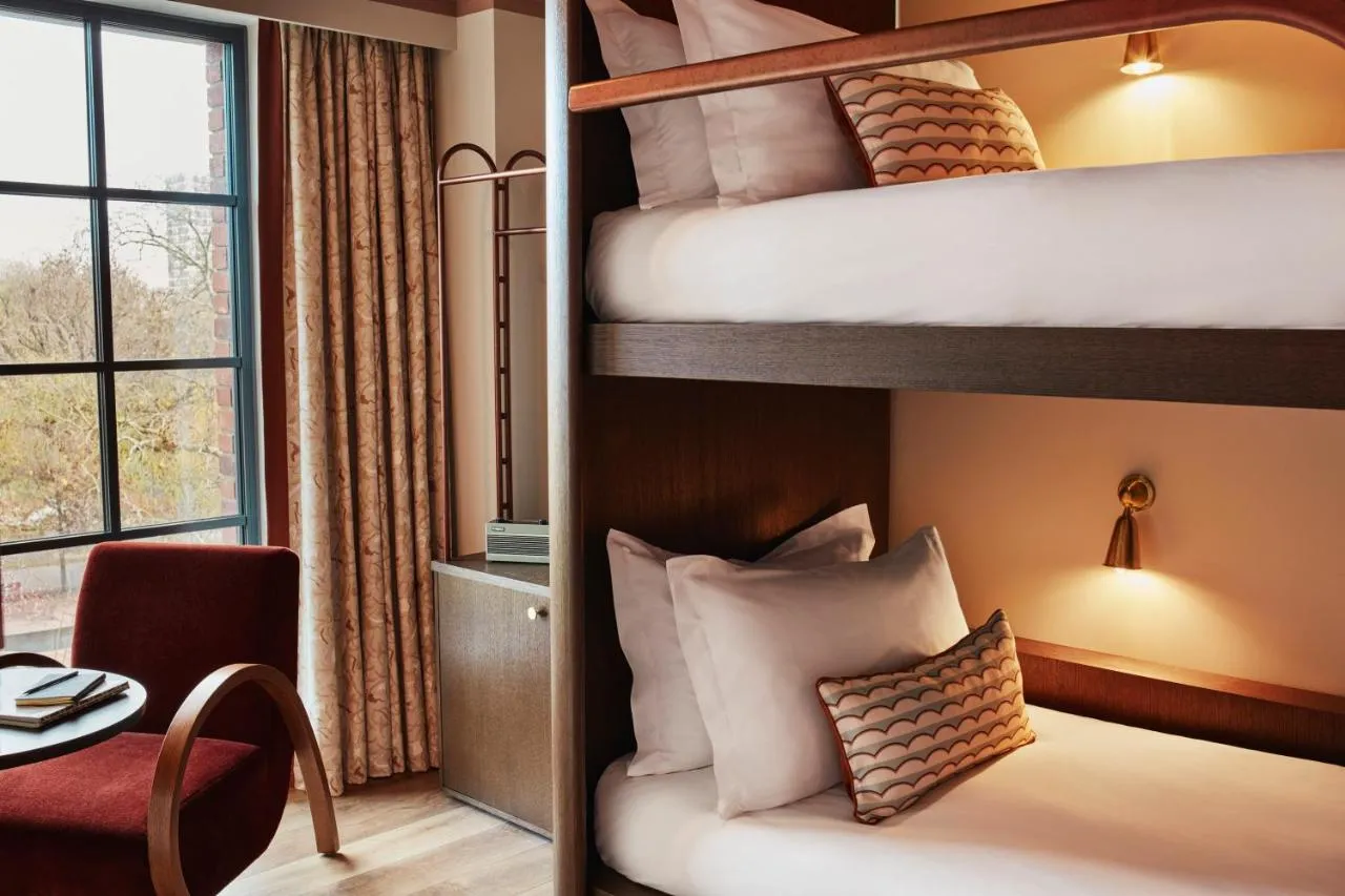 The Hoxton Shepherd's Bush boutique hotel - bunk room with reading lights and a window armchair nook