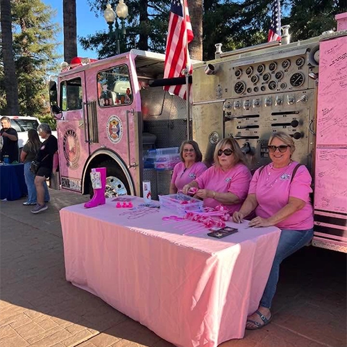 A group of first responders and young trainees in their uniforms.