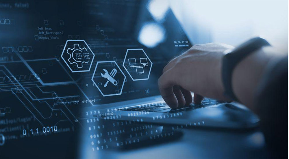 Hand typing on a laptop with managed IT service icons overlaid on a digital network display.