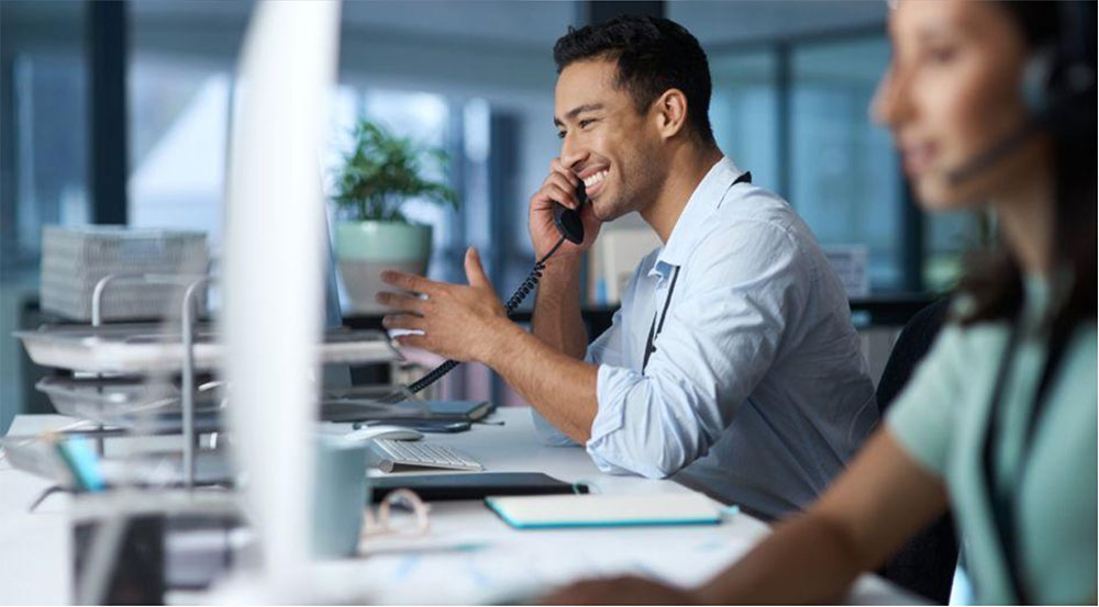 IT support technician on the phone providing managed IT solutions for a small business.
