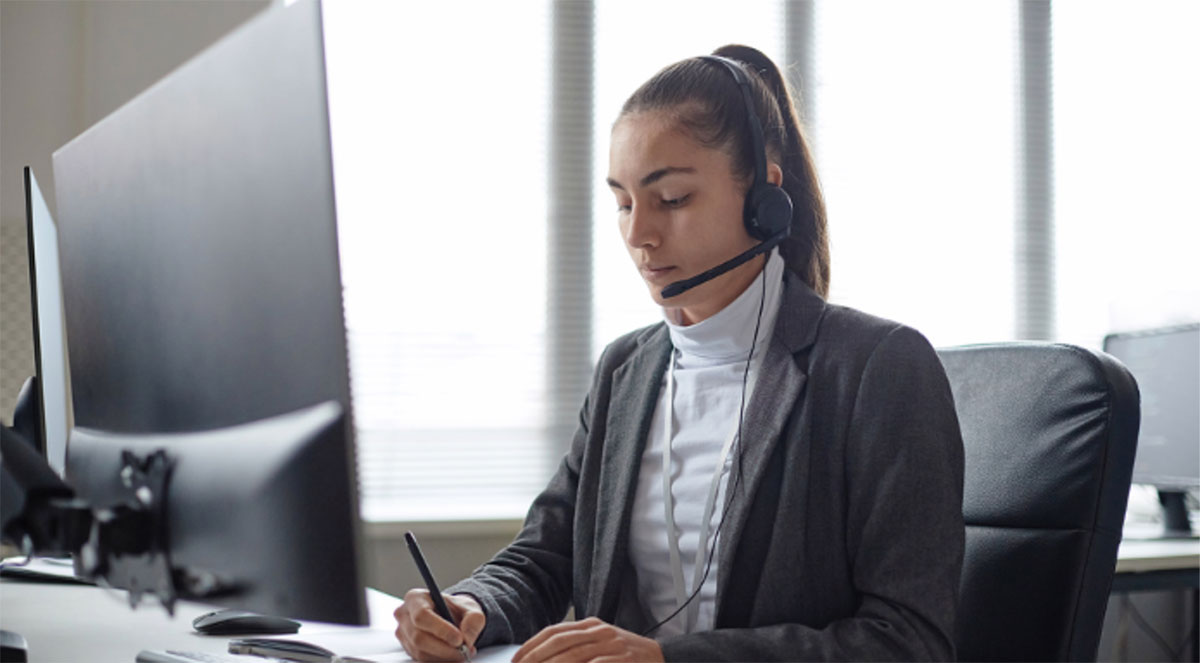 IT support technician with headset providing managed security services to businesses in Warrenton, VA