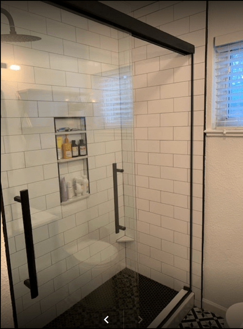 Contrasting black and white tile in a bathroom remodel