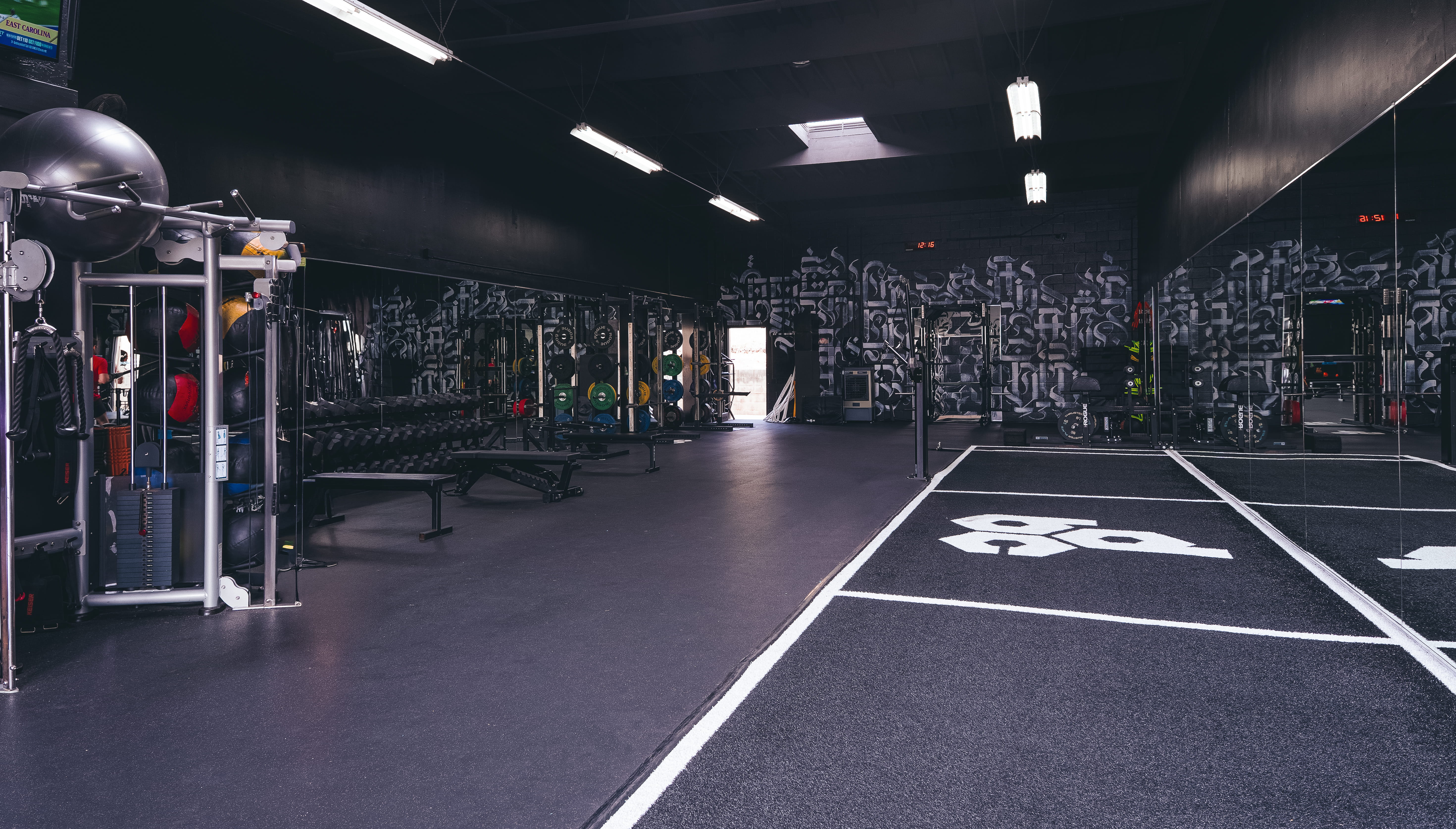 DBC Fitness San Diego trainer guiding client through a biomechanics-based lunge for strength and mobility.