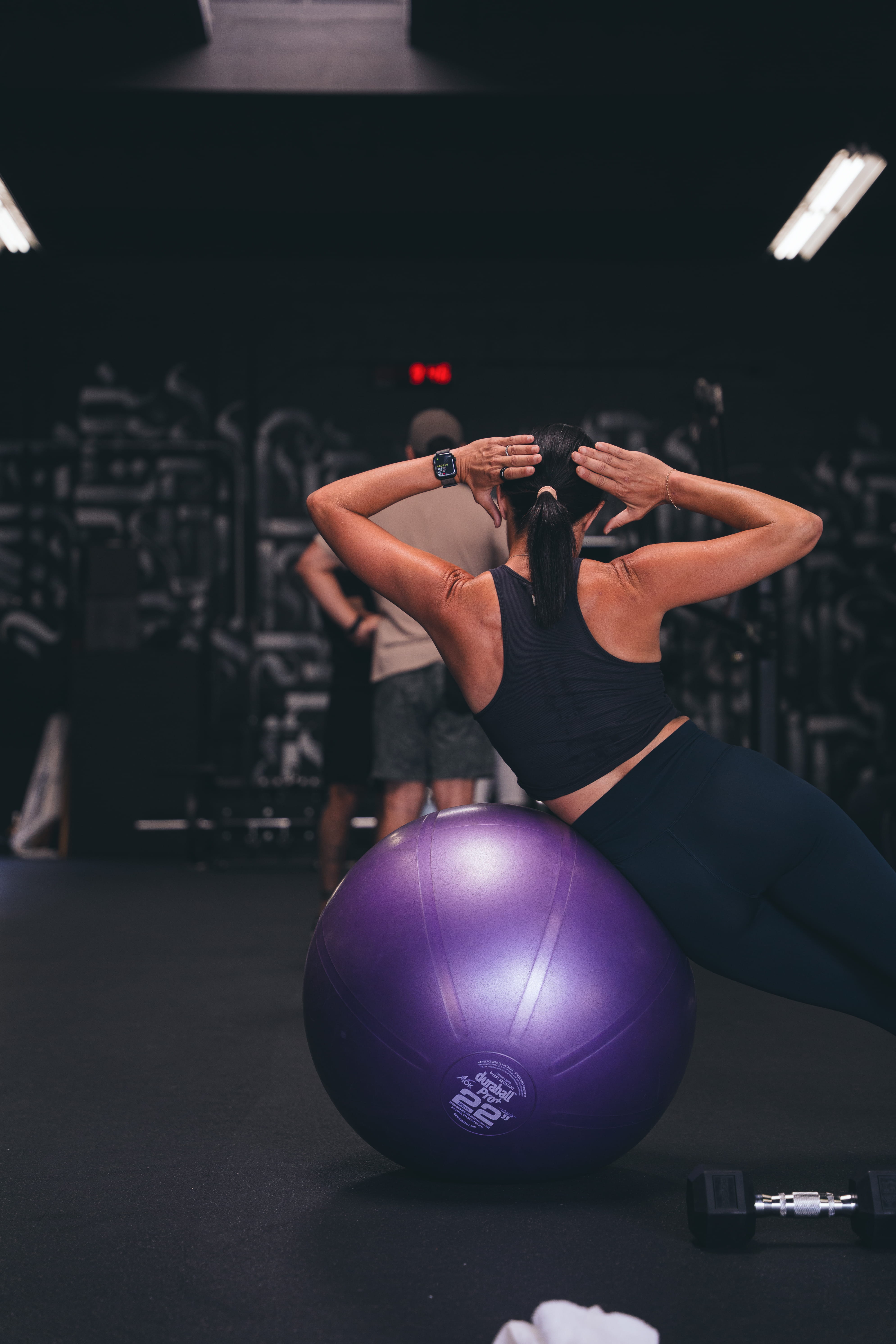 DBC Fitness San Diego trainer guiding client through a biomechanics-based lunge for strength and mobility.