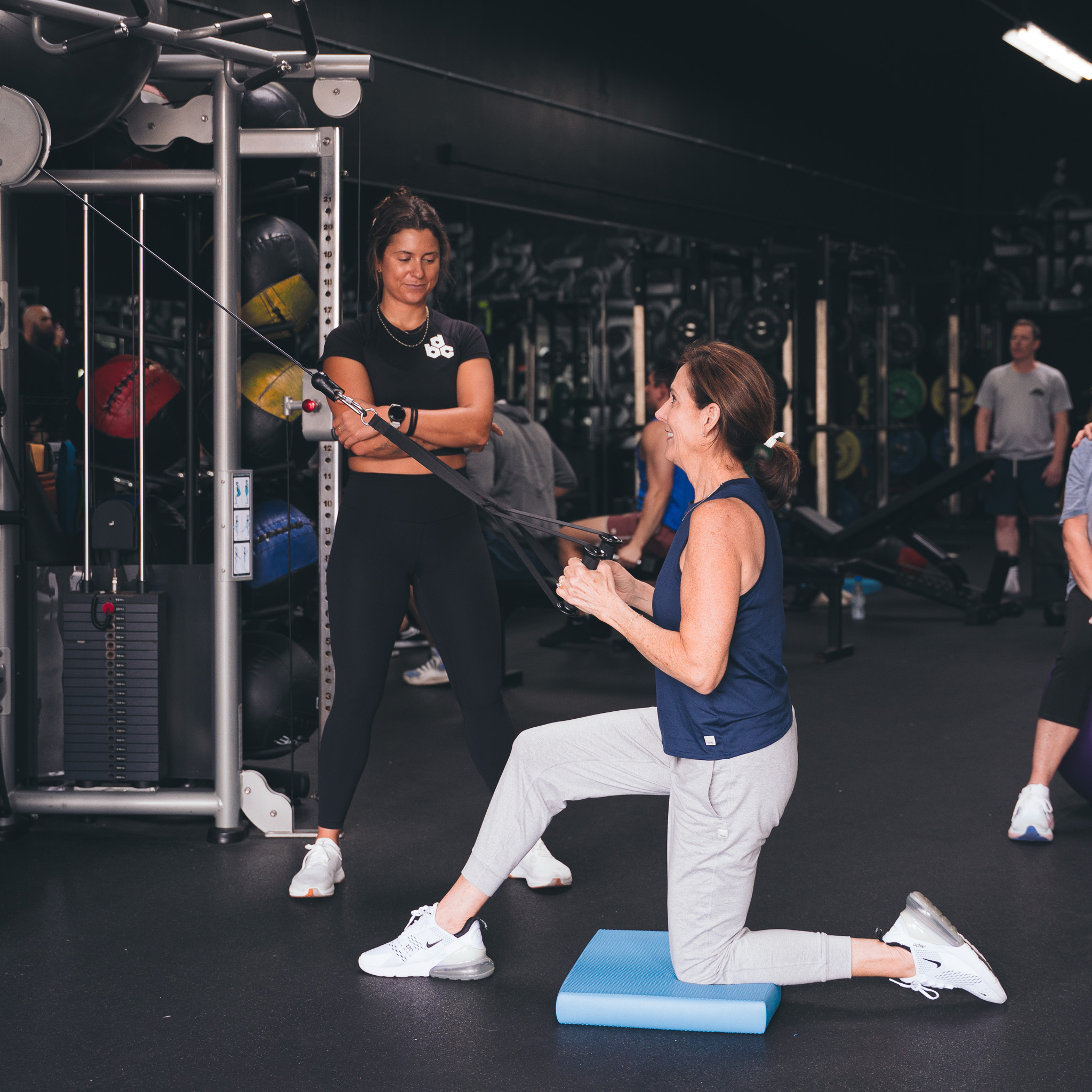 Client performing movement evaluation at Carlsbad personal training facility to assess posture, mobility, and strength.