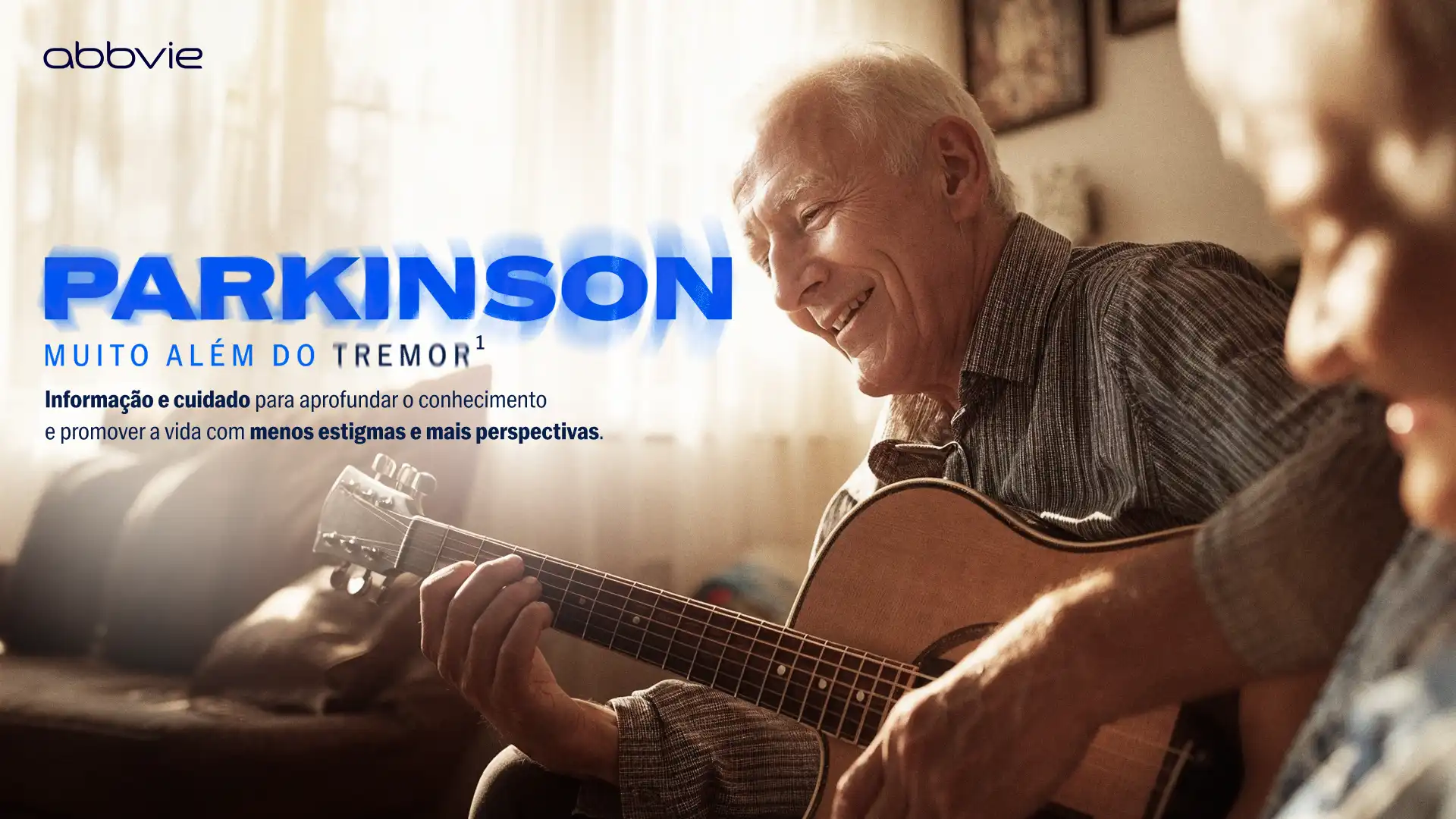 AbbVie Parkinson campaign key visual: an older man playing guitar and laughing at home