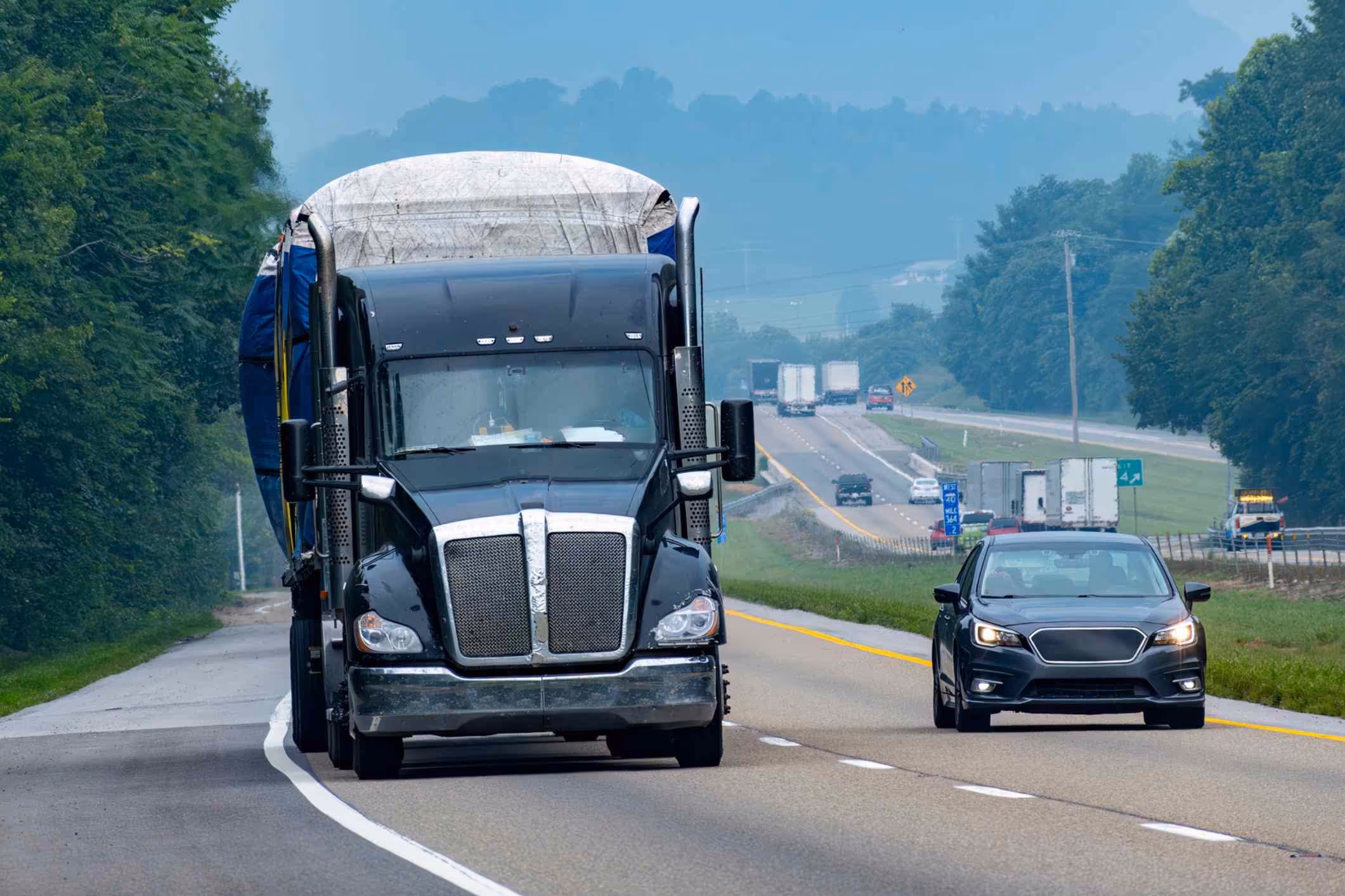 Busy highway traffic in hazy conditions, reflecting challenges handled by a Pearland truck accident lawyer.