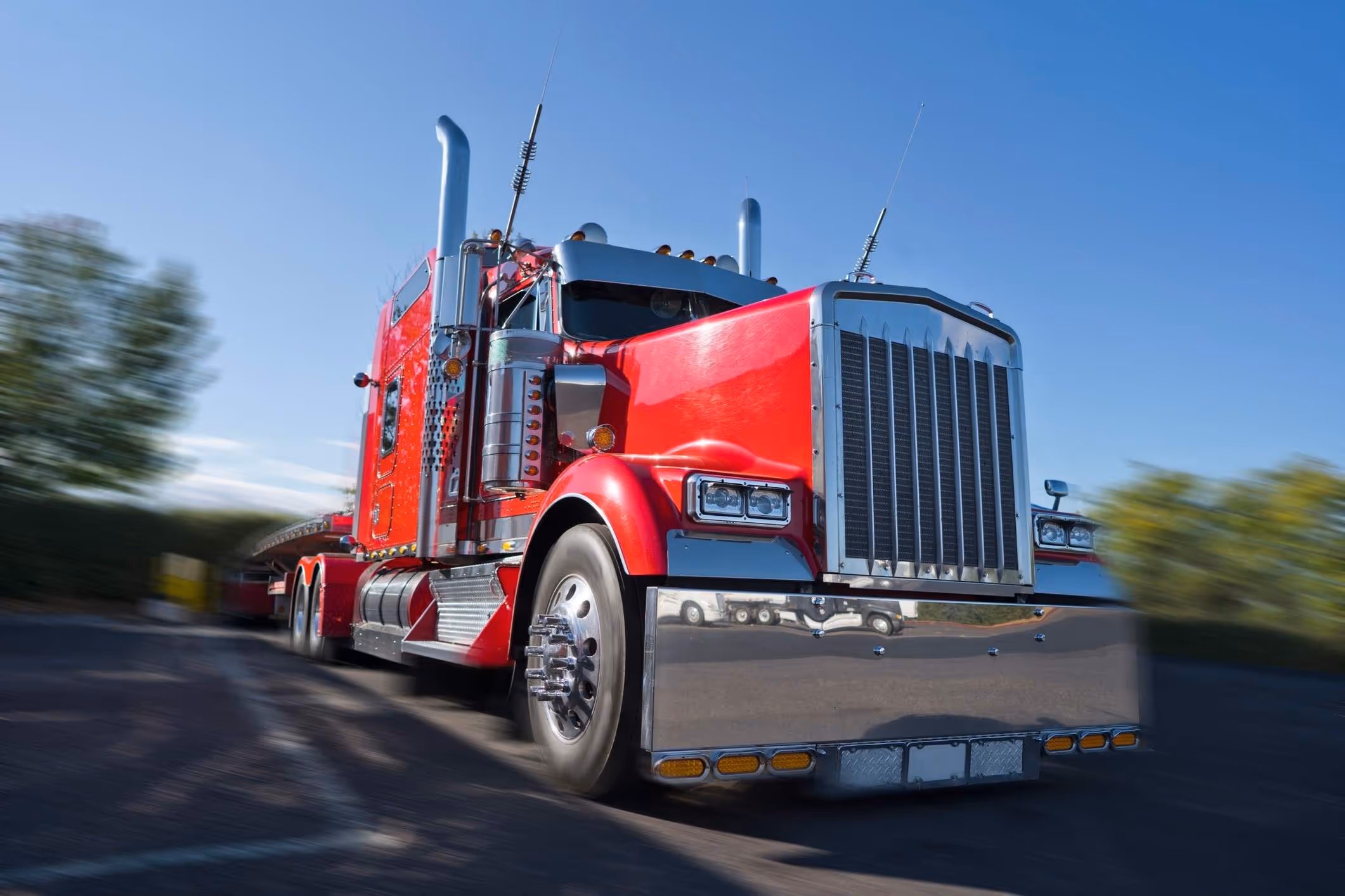 Large red semi-truck cab on road, illustrating a case handled by an Atascocita truck accident lawyer.