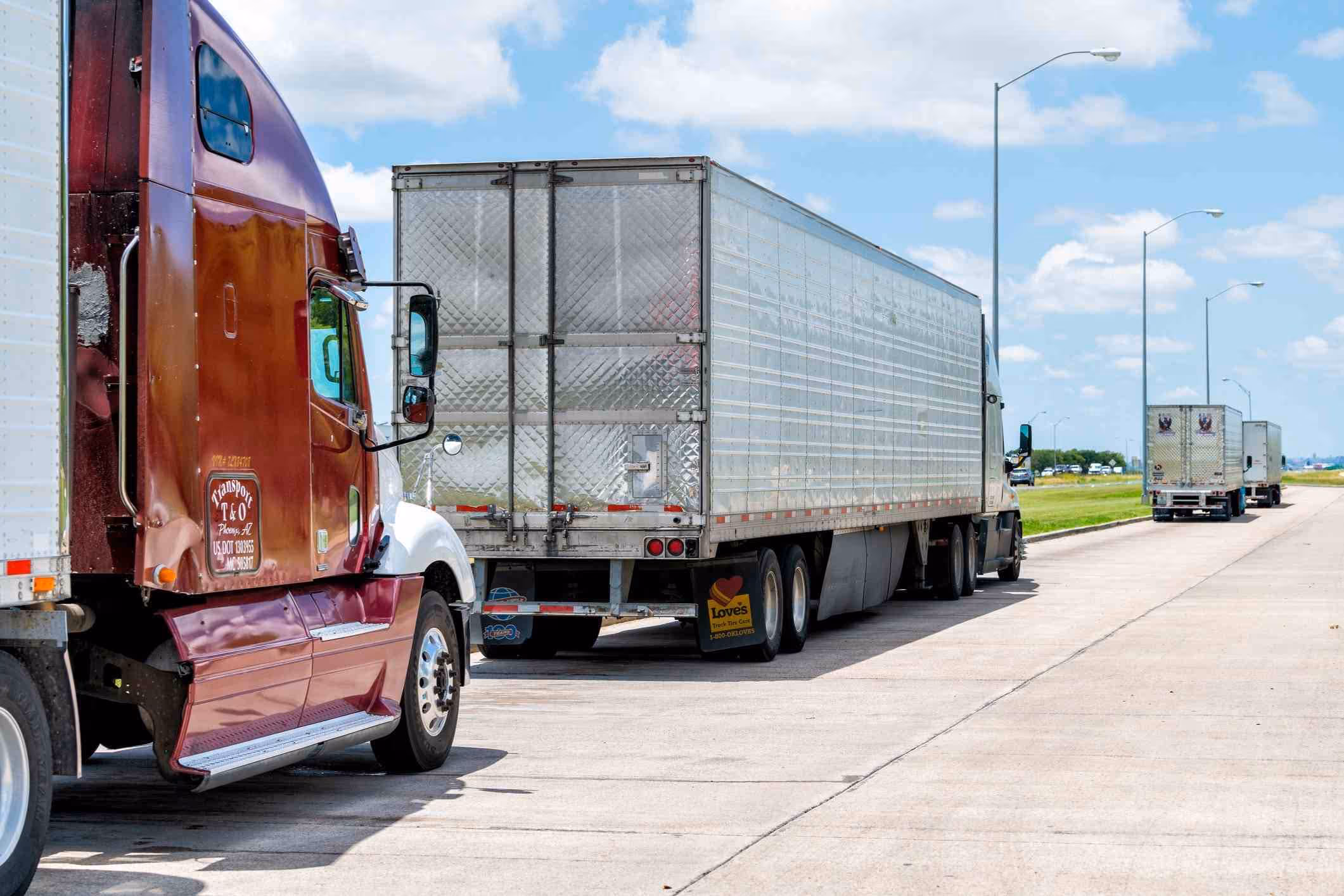 Commercial trucks at highway stop, representing Spring truck accident lawyer injury cases.