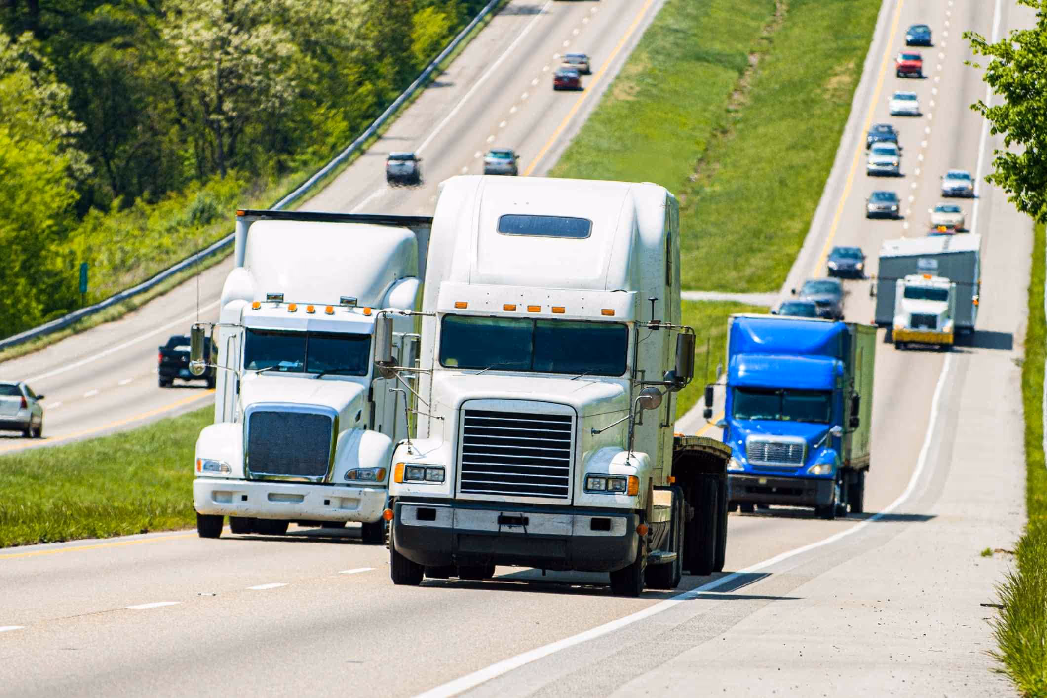Commercial trucks on busy Texas highway representing Deer Park truck accident lawyer cases.