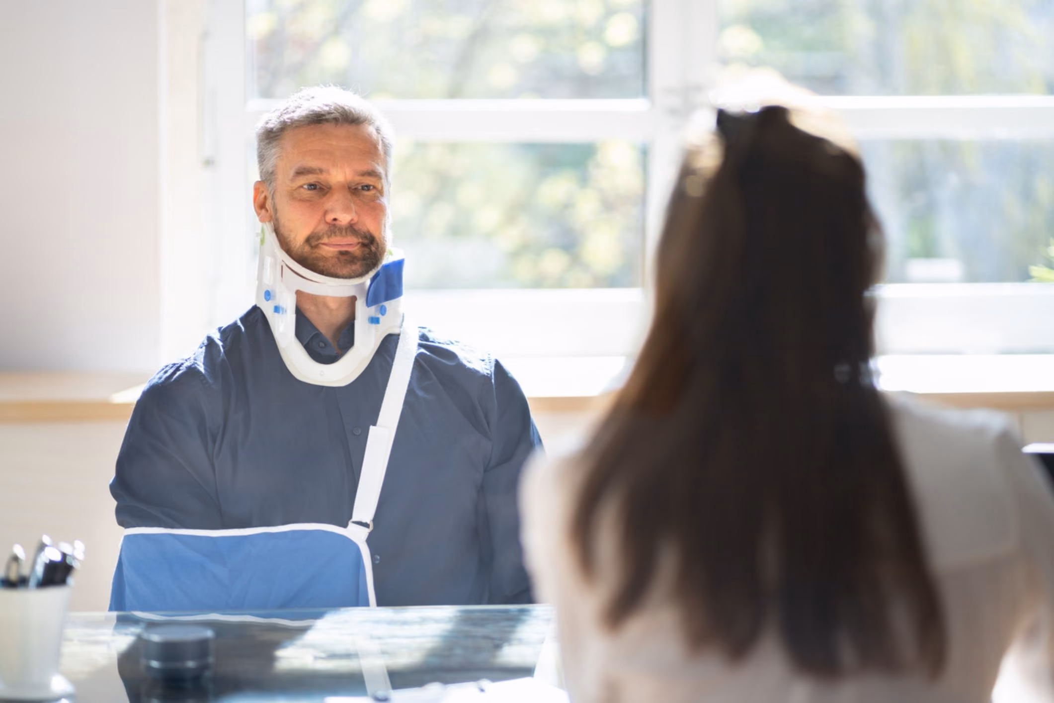 Person reviewing insurance claim paperwork, tied to a Tomball personal injury lawyer case.