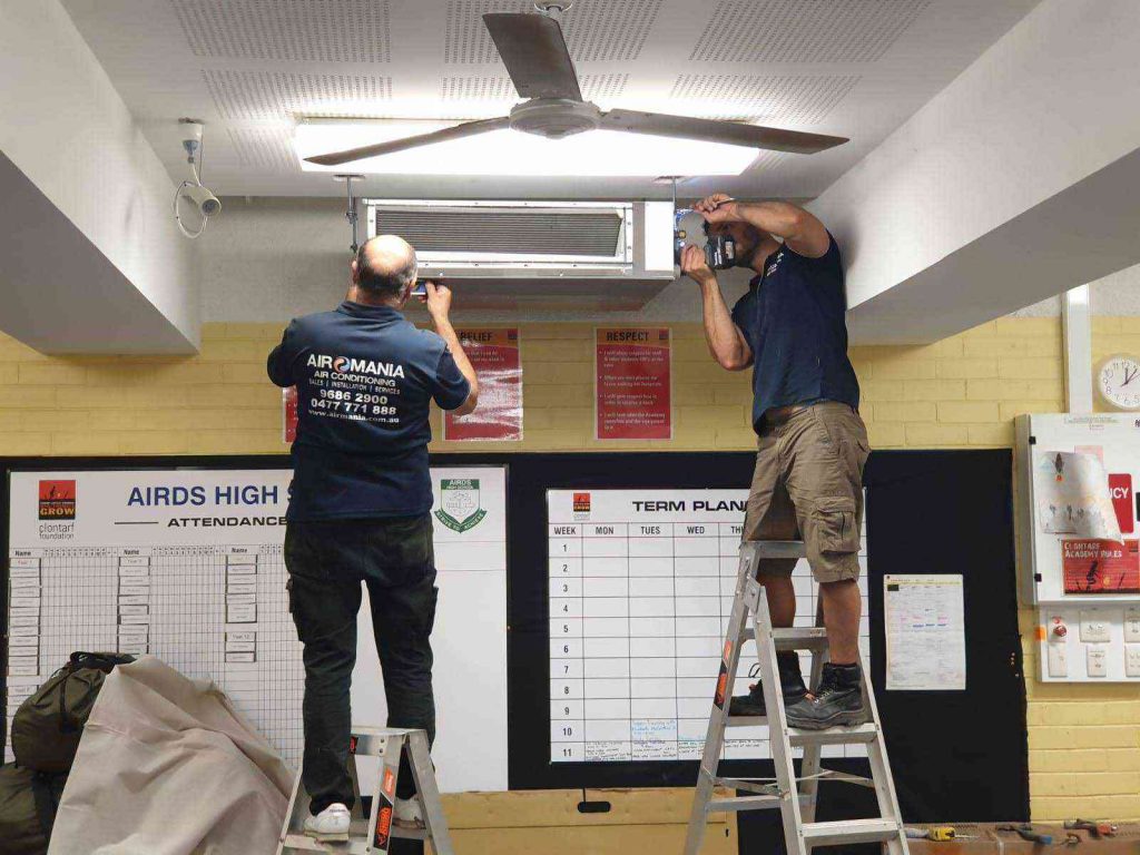 Airomania technicians at work on ducted system