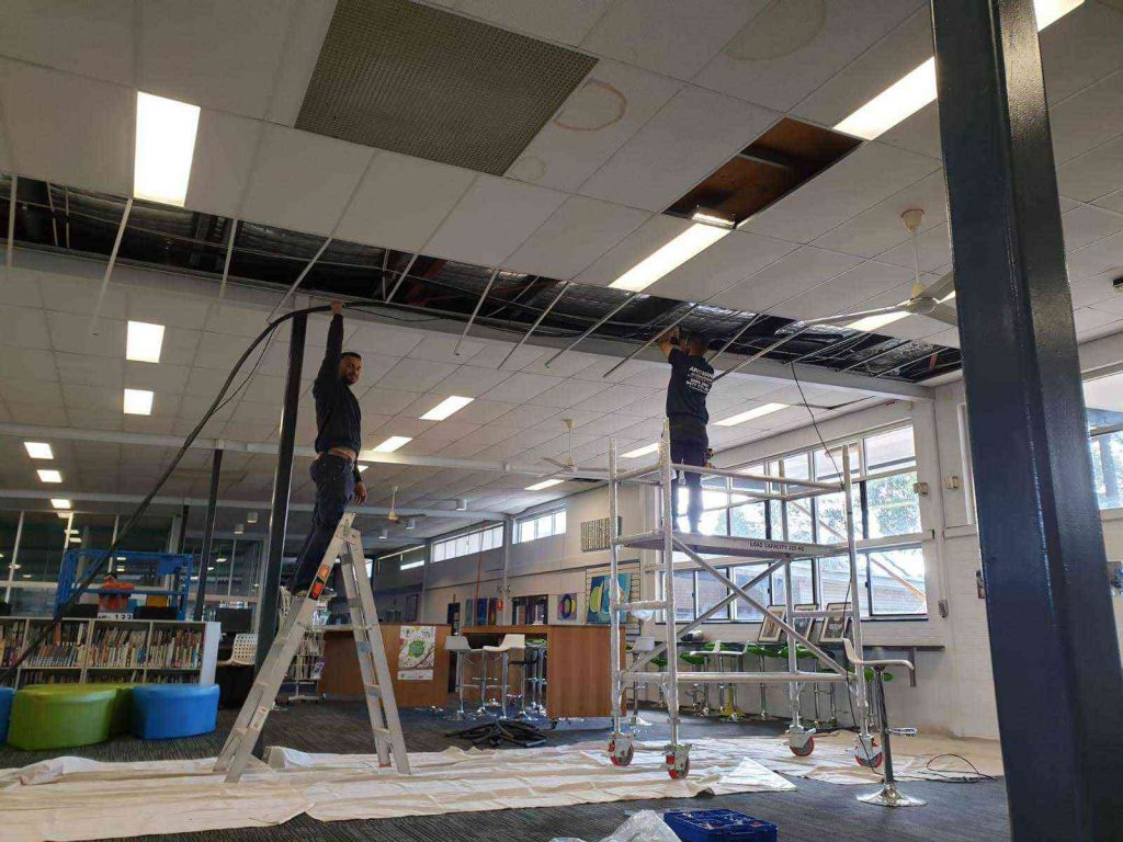 Airomania technician at work on ladder