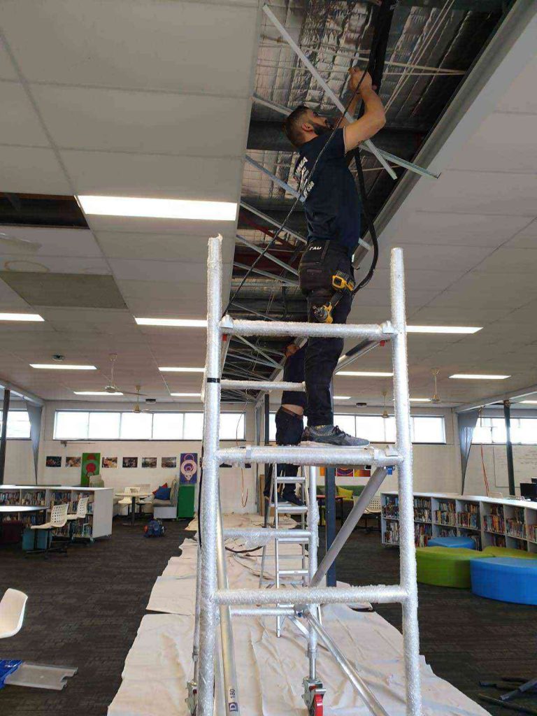 Airomania technician at work on scaffolding
