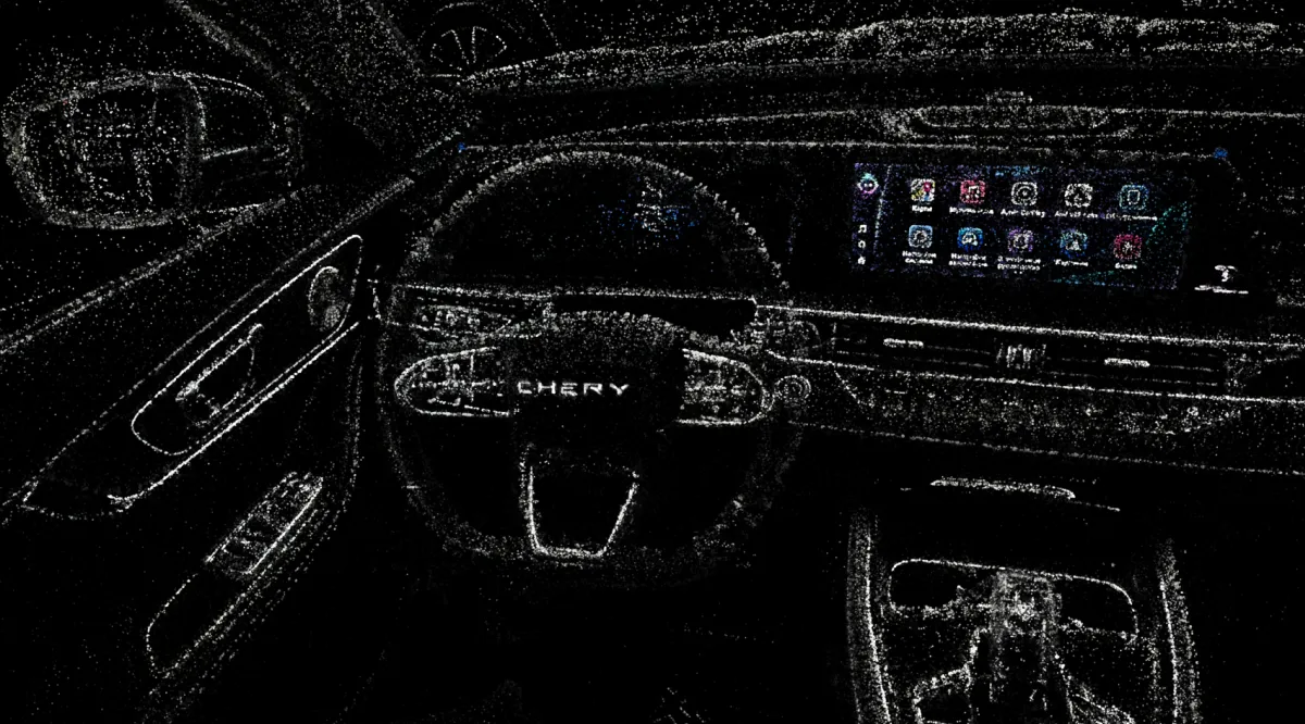 The image depicts a 3D point cloud representation of a car's interior. The dashboard, steering wheel, and center console are shown using scattered light points, creating a wireframe-like structure. The display screen in the center is also visible, showing various app icons.