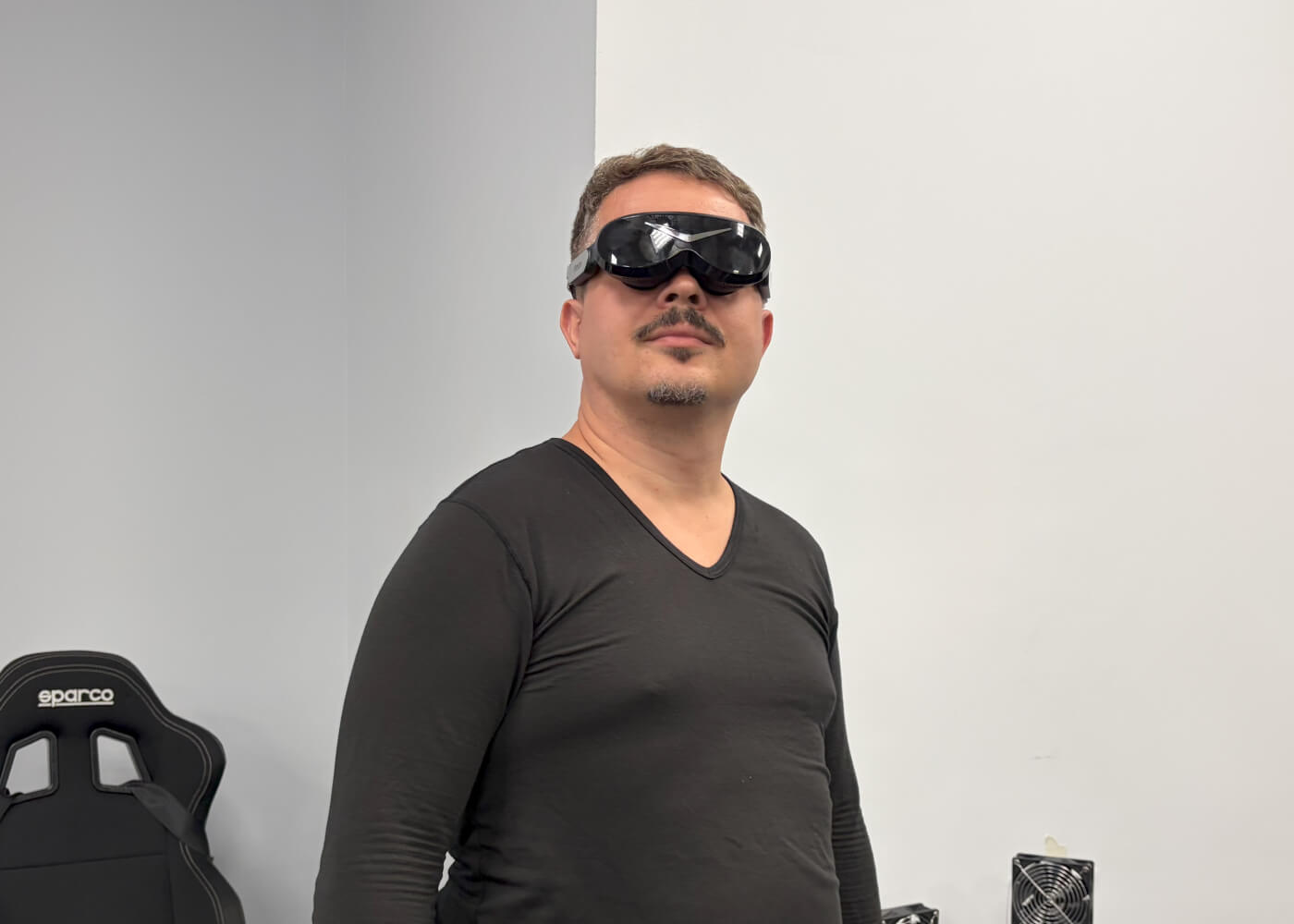 A man is wearing a PIMAX VR headset