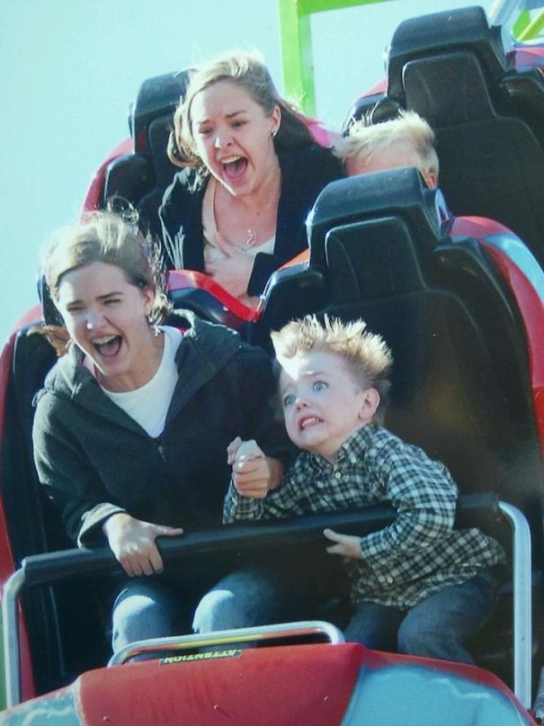 A photo of people taking a ride on rollercoasters