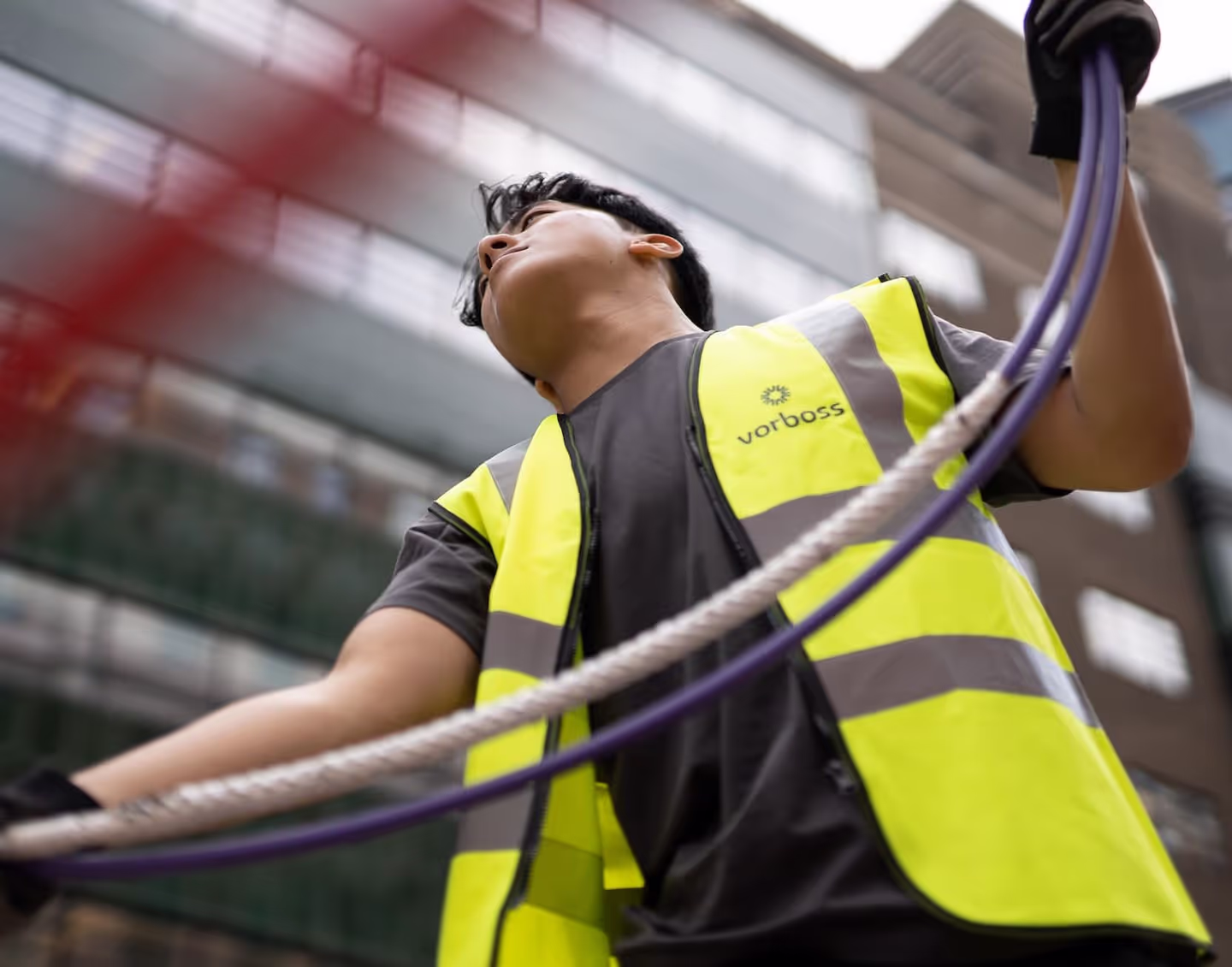 Vorboss installation technician working with fibre optic cables.
