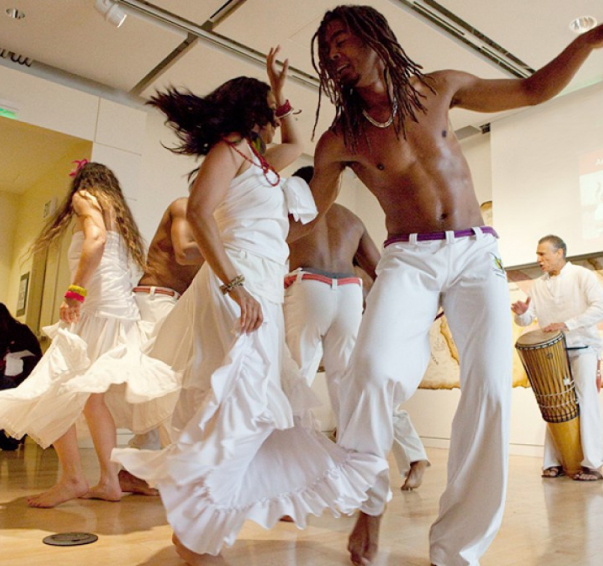 A museum event with dancers dancing and performing